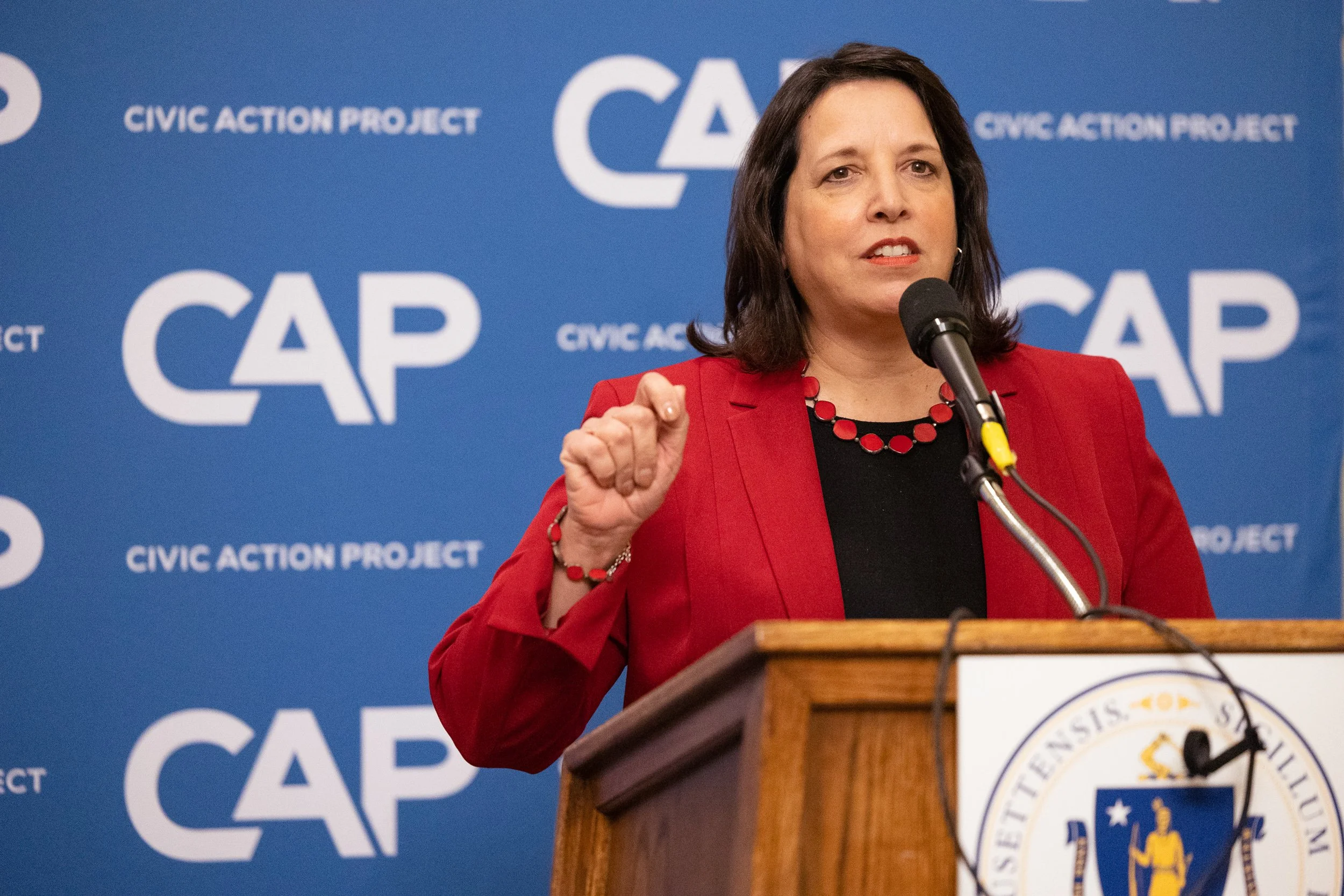 Kim Driscoll a speech at a podium at an event at the Massachusetts State House in Boston.