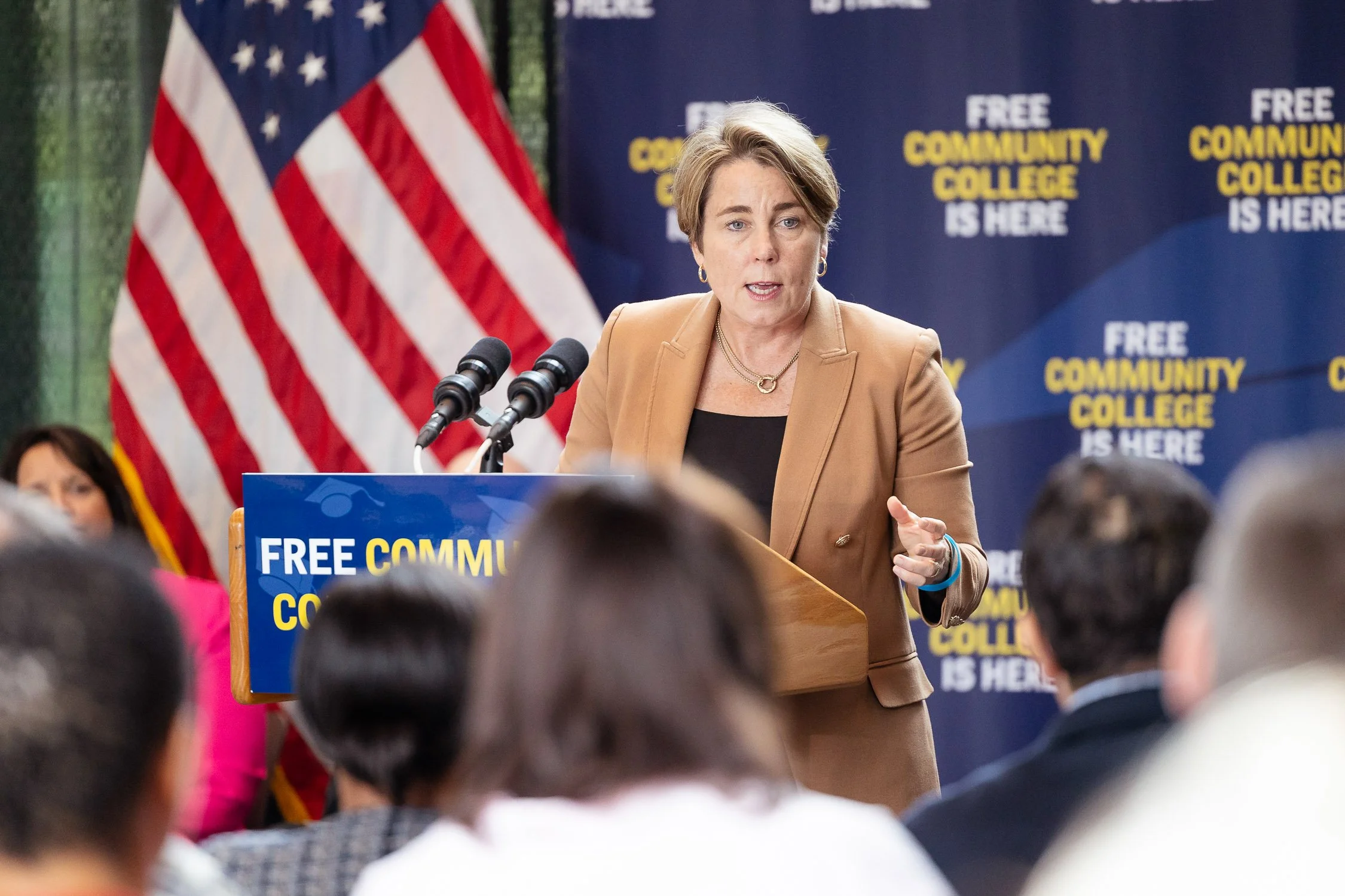 Massachusetts Governor Maura Healy speaking at podium at MassBay Community College to announce free community college in Massachusetts.
