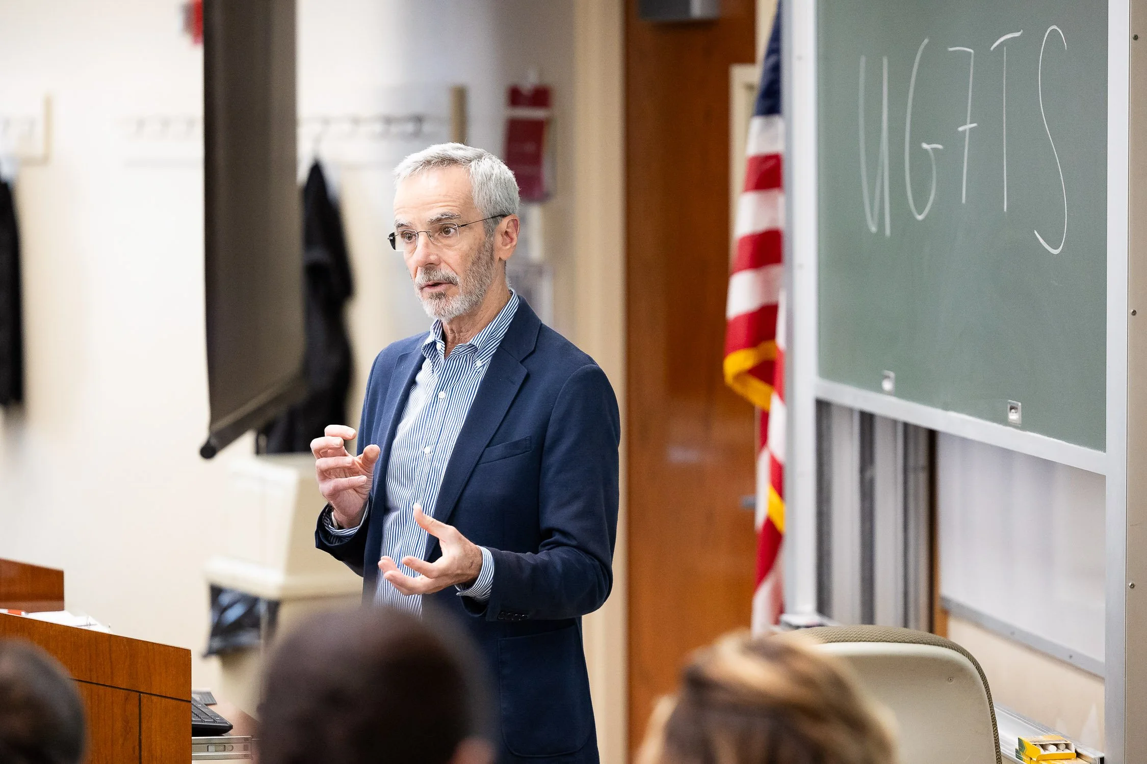 A law professor giving a lecture in a classroom at a Boston law school.