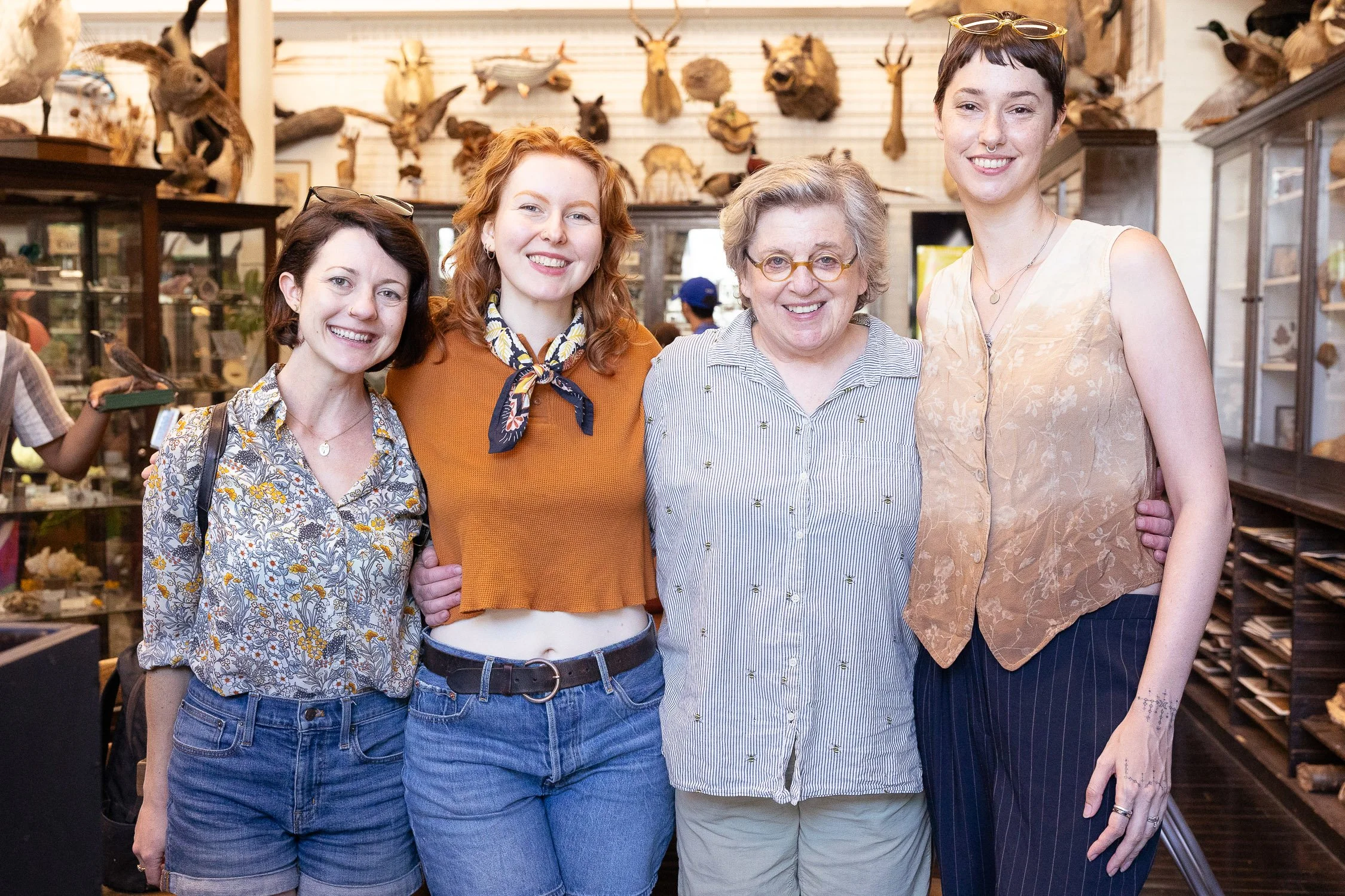 Four women standing together at the nature lab at the Rhode Island School of Design.