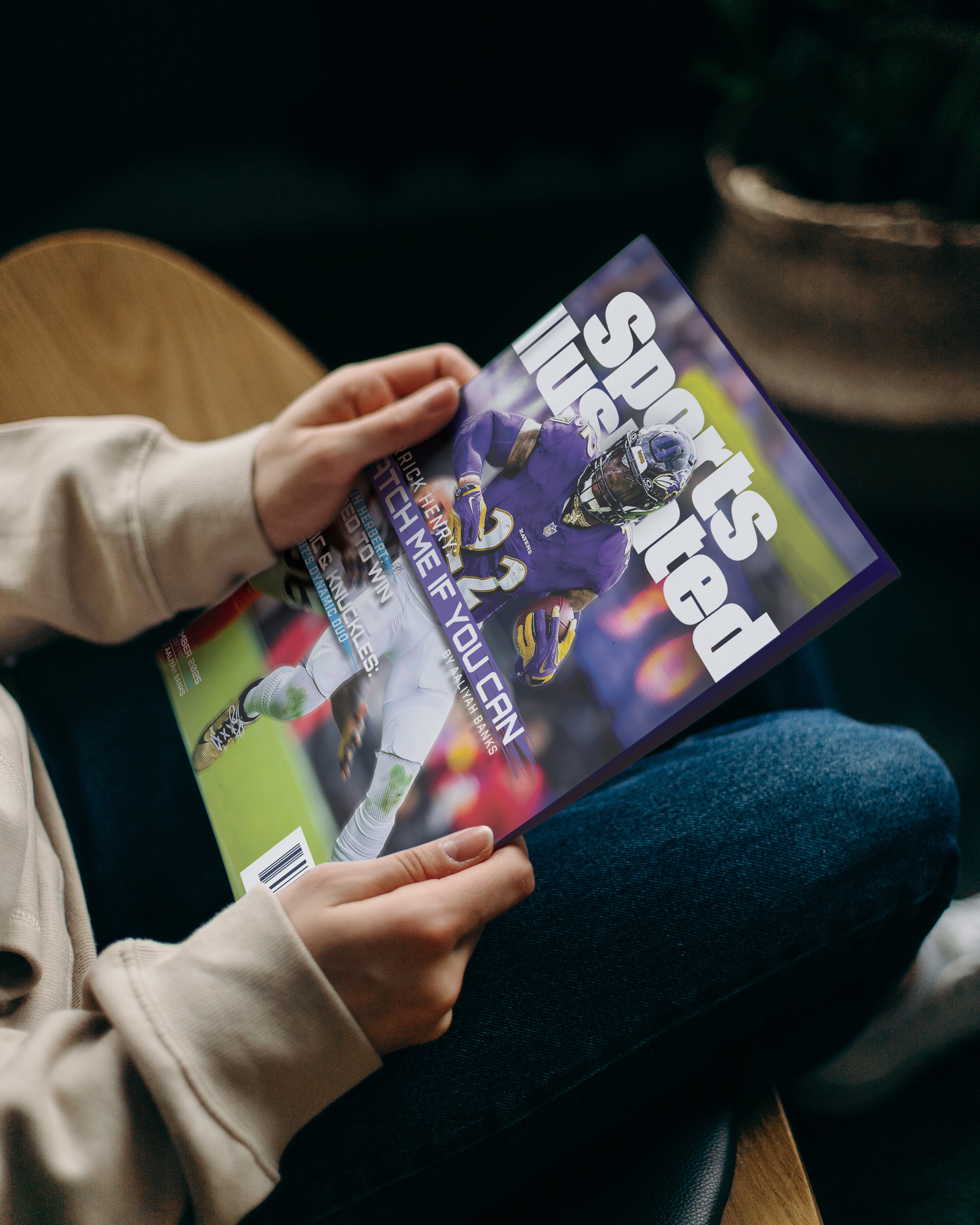 Woman holding size accurate printed version of Sports Illustrated.