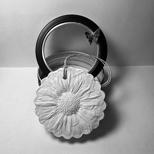 Botanical Bas Relief Essential Oil Diffuser designed to look like a flower with a butterfly ornament