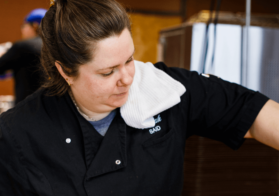 Sarah Foster, co-owner of SAID, preparing meals and overseeing heartfelt food services in Columbus, Ohio.