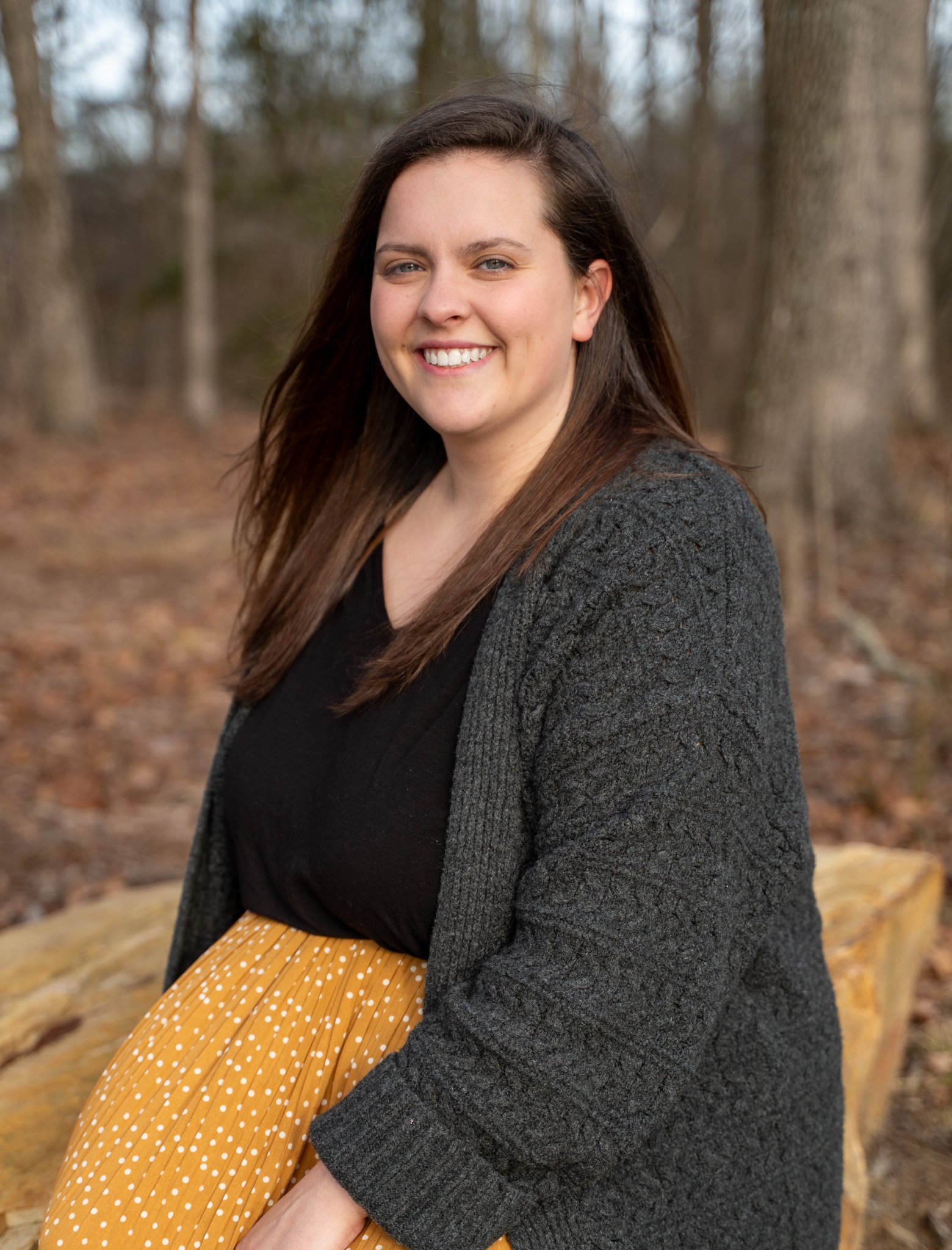 Mount Pleasant therapist Anna Wise smiling outdoors with trees in background