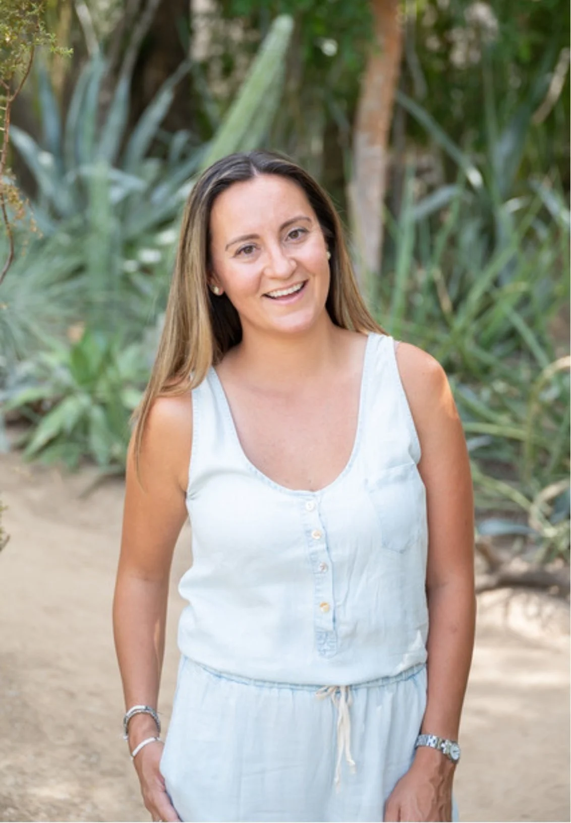 Mount Pleasant therapist Pam Phelan standing outdoors smiling with greenery behind her