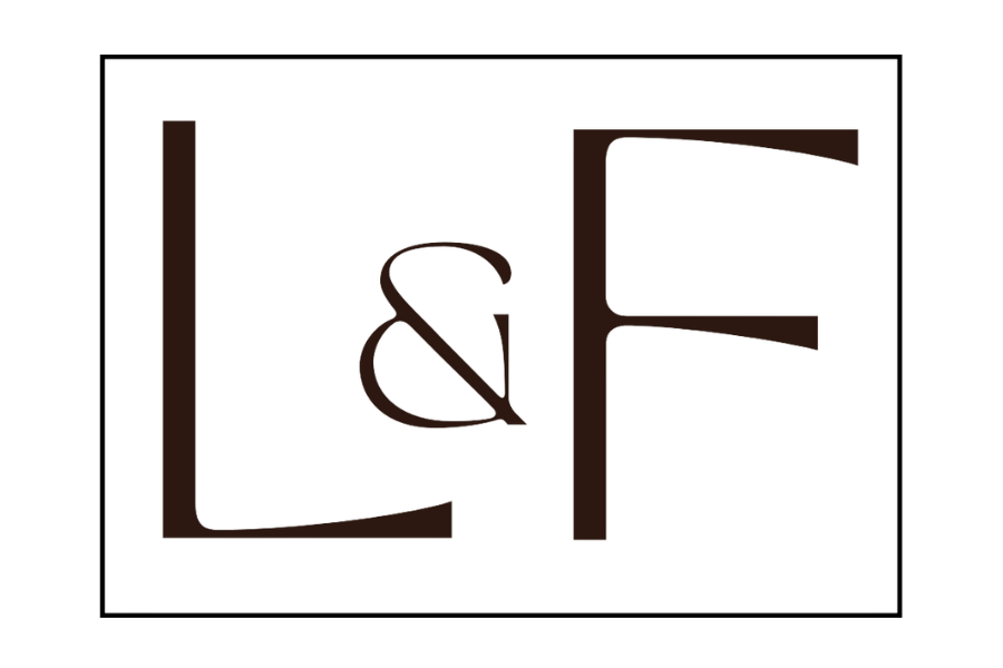 Black and brown logo with the letters "L" and "F" separated by an ampersand (&), all enclosed in a thin rectangle border.