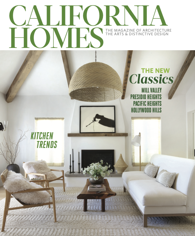 Cover of California Homes magazine featuring a modern living room with a white couch and wooden armchairs, a coffee table with flowers, a fireplace, and a large woven pendant light, set in a room with exposed beams and a minimalist design.