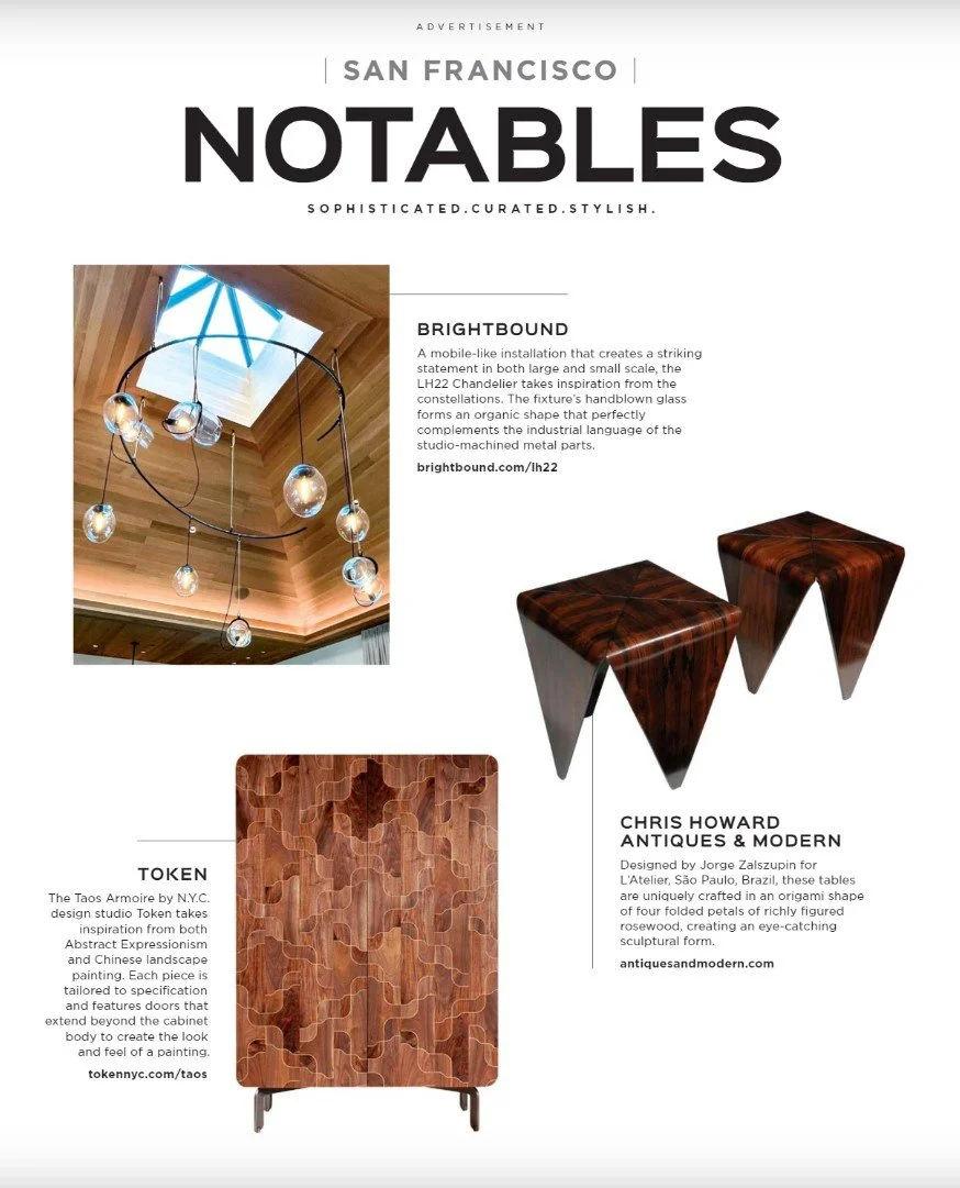 Page from a magazine or advertisement showcasing notable designs from San Francisco. It features a modern lighting fixture named Brightbound with hanging glass orbs, two wooden stools designed by Chris Howard with lush wood grain, and a wooden cabine