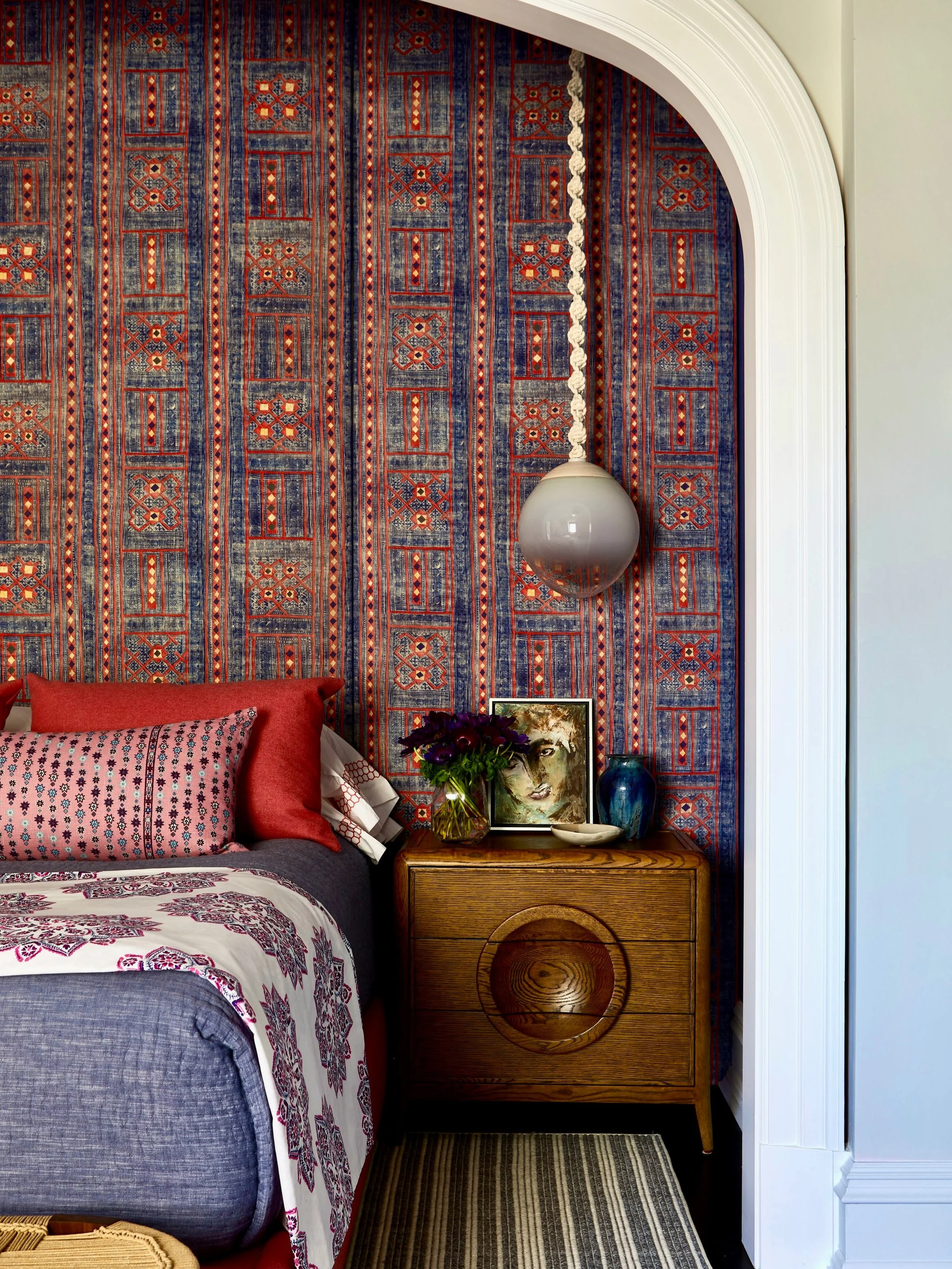 The balance of richness and restraint happens to be a regular on our Bingo Card.

Though a room this thoughtfully considered has little to do with the luck of the draw.

Wallpaper goals? Check. 
Rich, warm crimson and deep denim navy? Check. 
Plants 