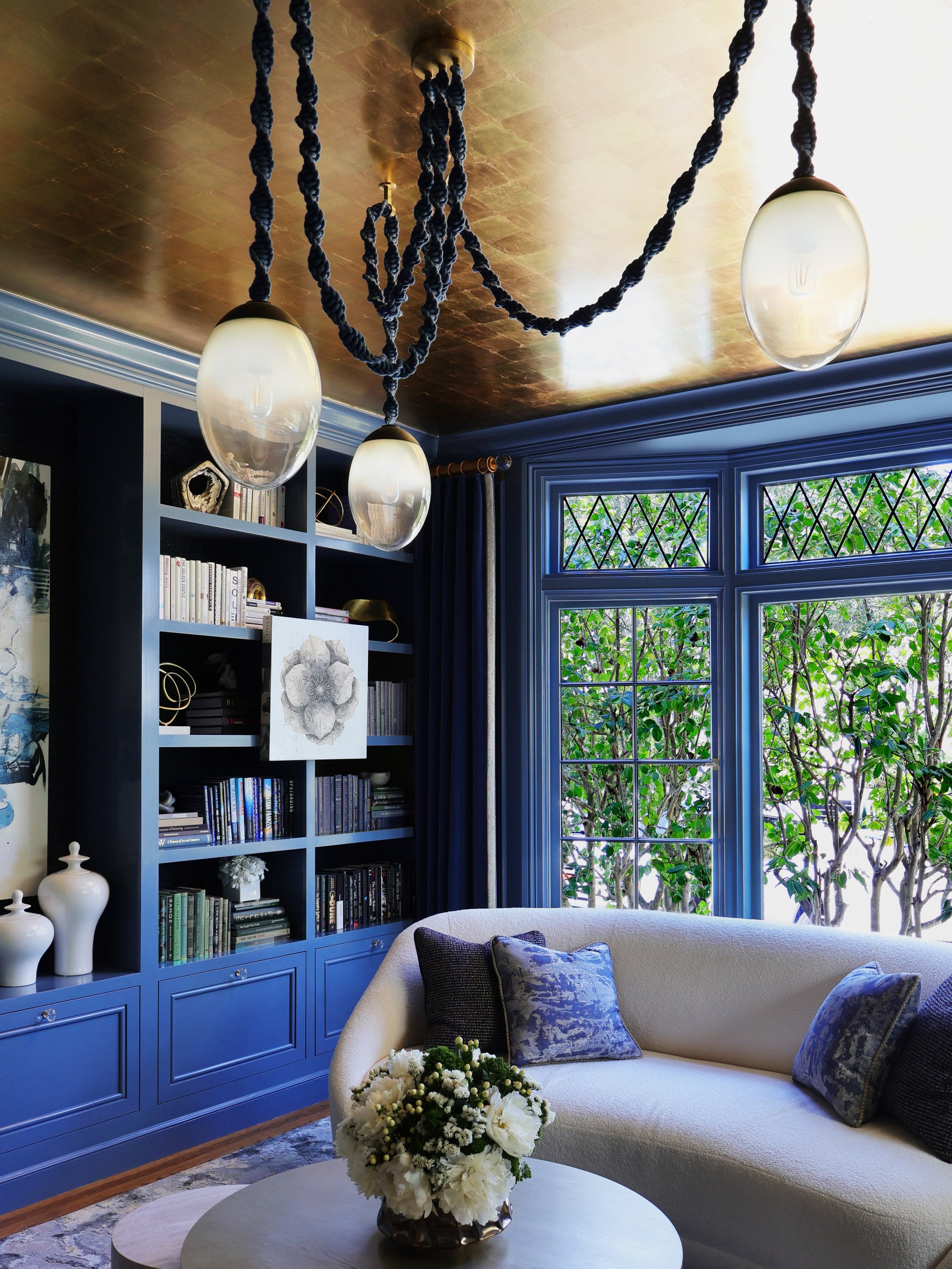 A home library should make you want to stay awhile, and this one certainly does.

Wrapped in blue, accented with gold and lined with books, this Hillsborough home library is the kind of room that invites you to settle in and lose track of time. 

Ove