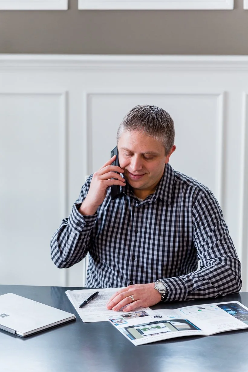 Clay Burris speaking on the phone, Fishers Indiana real estate advisor