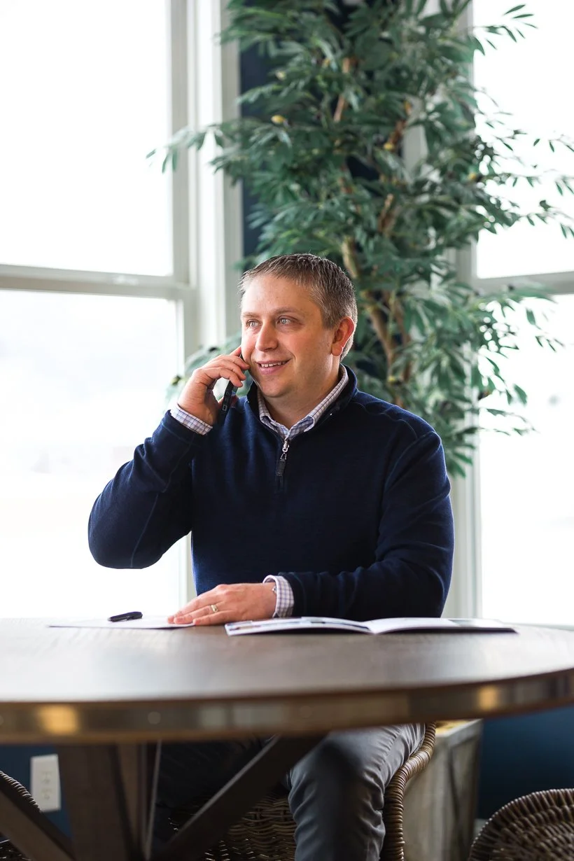 Clay Burris speaking on the phone, Fishers Indiana real estate advisor