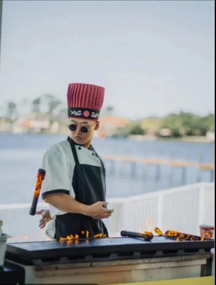 Private hibachi chef for Destin bachelorette party cooking outdoors near the water for a luxury girls trip dining experience