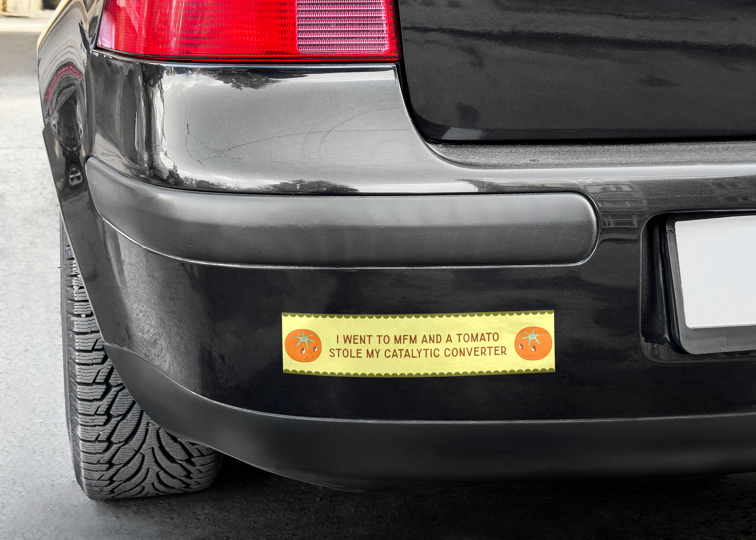 Slowpoke Studio refreshed the Memphis Farmers Market merch design adding anew revenue stream. Car with a bumper sticker that says, 'I WENT TO MFM AND A TOMATO STOLE MY CATALYTIC CONVERTER,' featuring small tomato illustrations with faces.