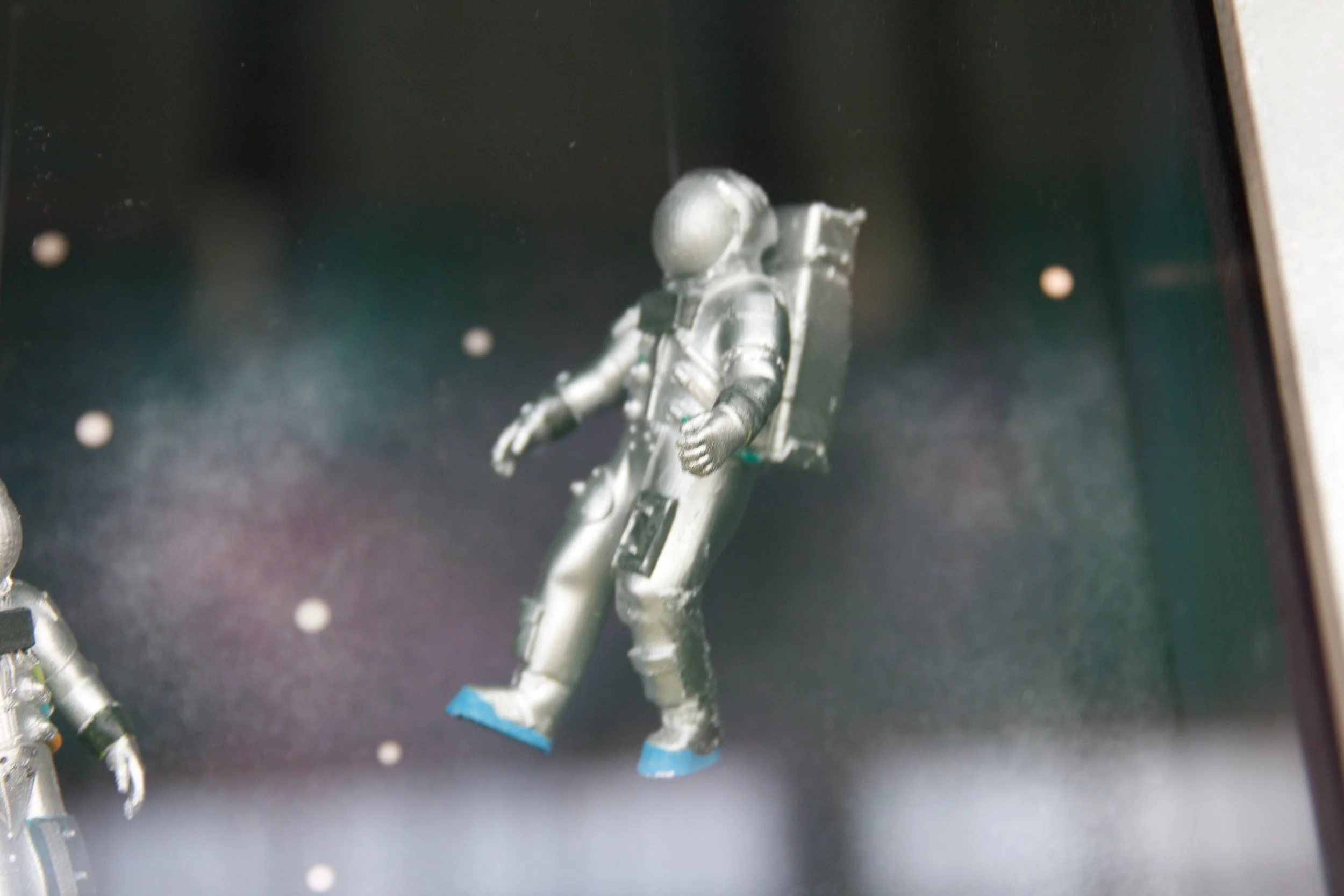 Slowpoke Studio’s website redesign for Wiseacre Brewing Company. Silver astronaut figurine floating in space with a black background and white stars.