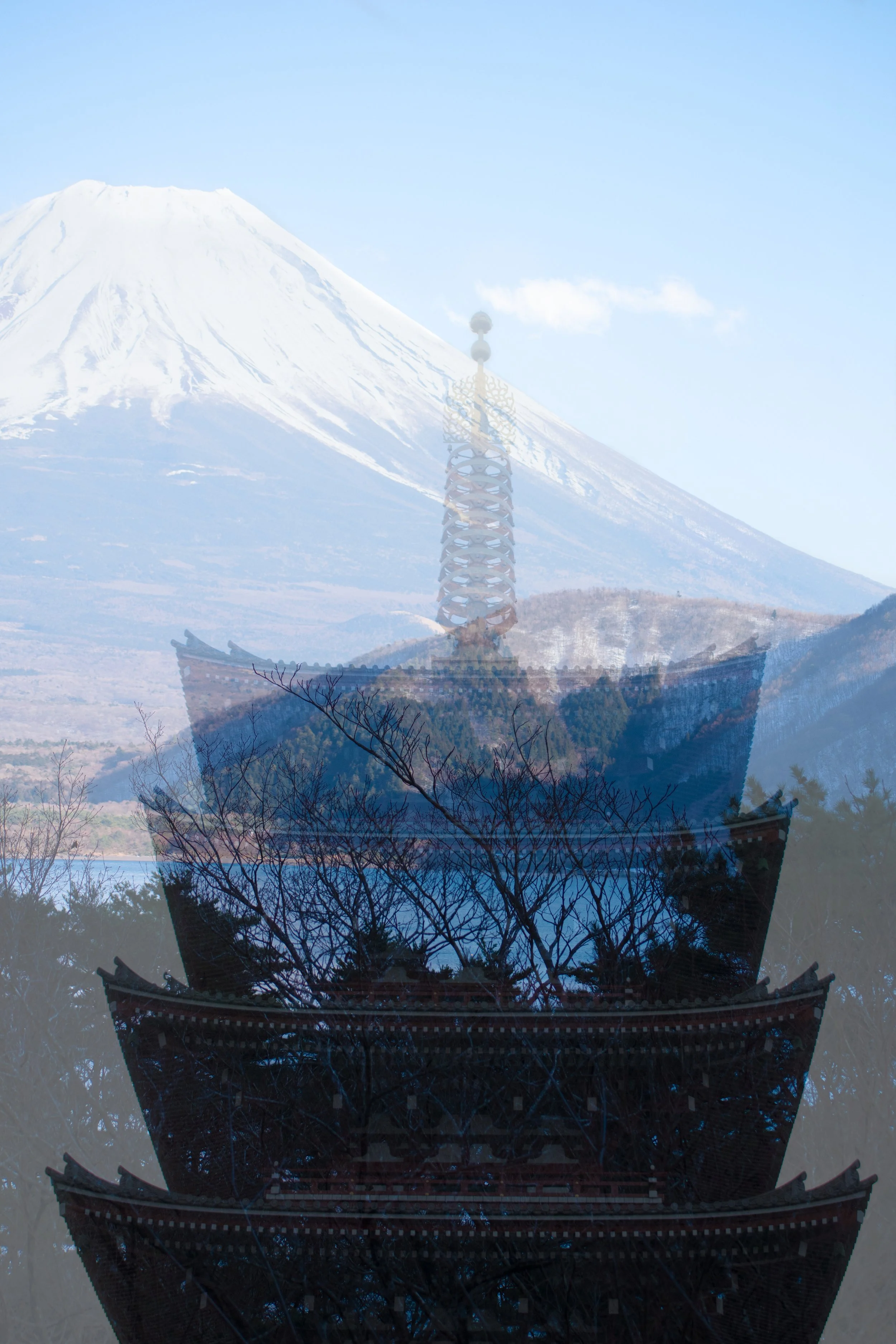 Japan double exposure film photo of tall traditional Japanese building overlaid with mount Fuji.