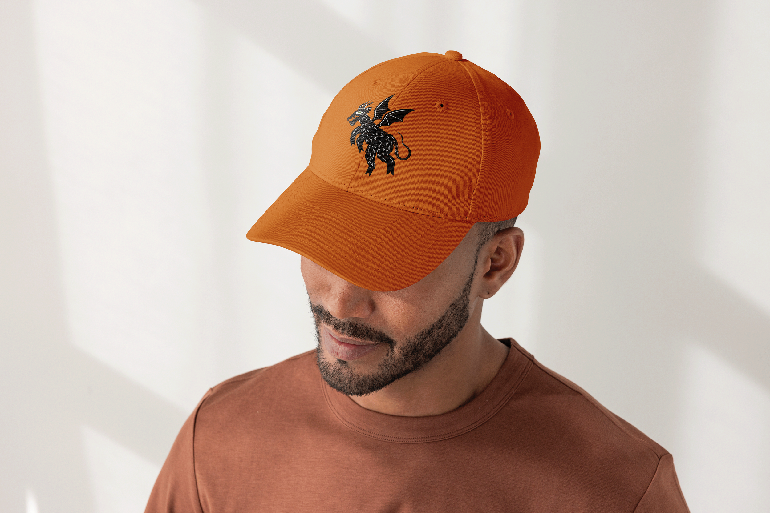 LURK baseball hat depicting folk stylized Jersey devil