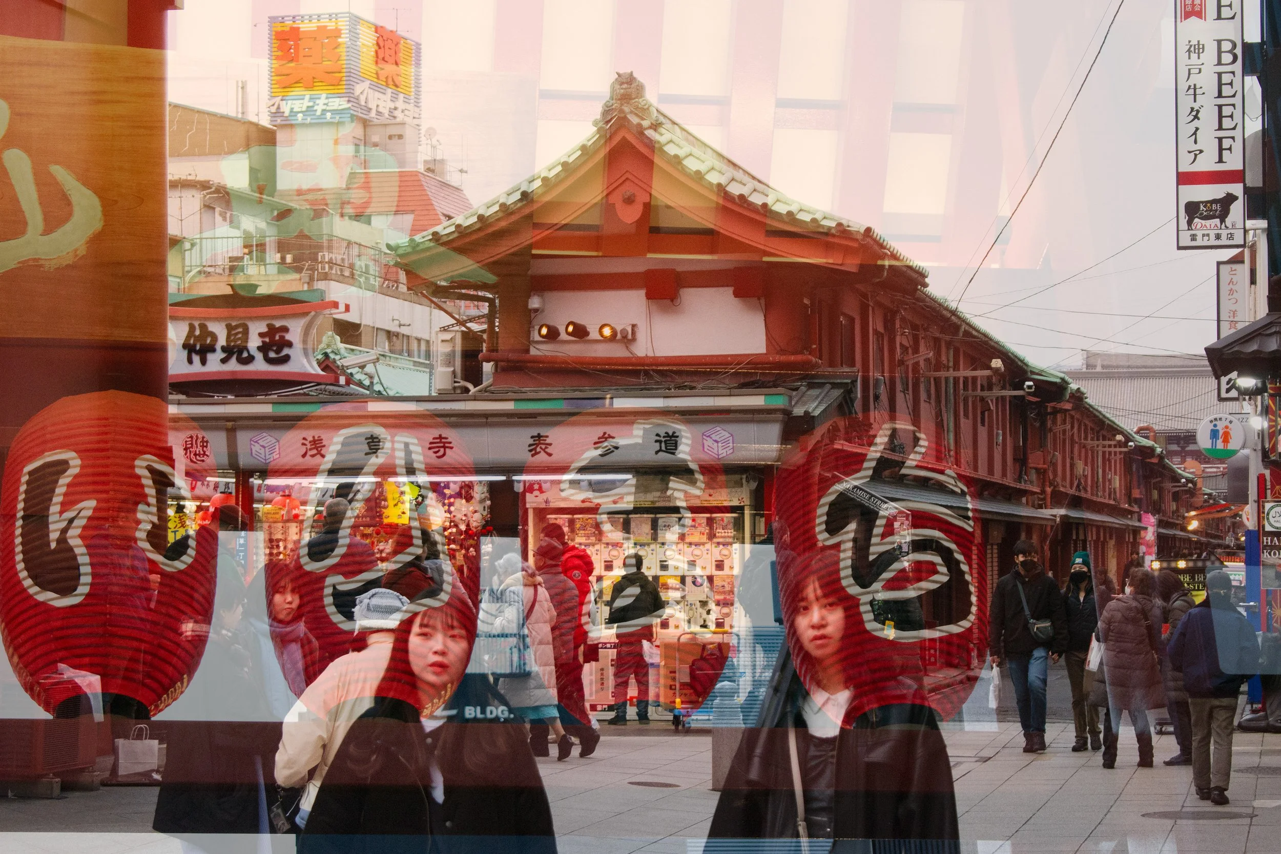 Japanese marketplace double exposure film photo with people walking and faces of two Japanese women.