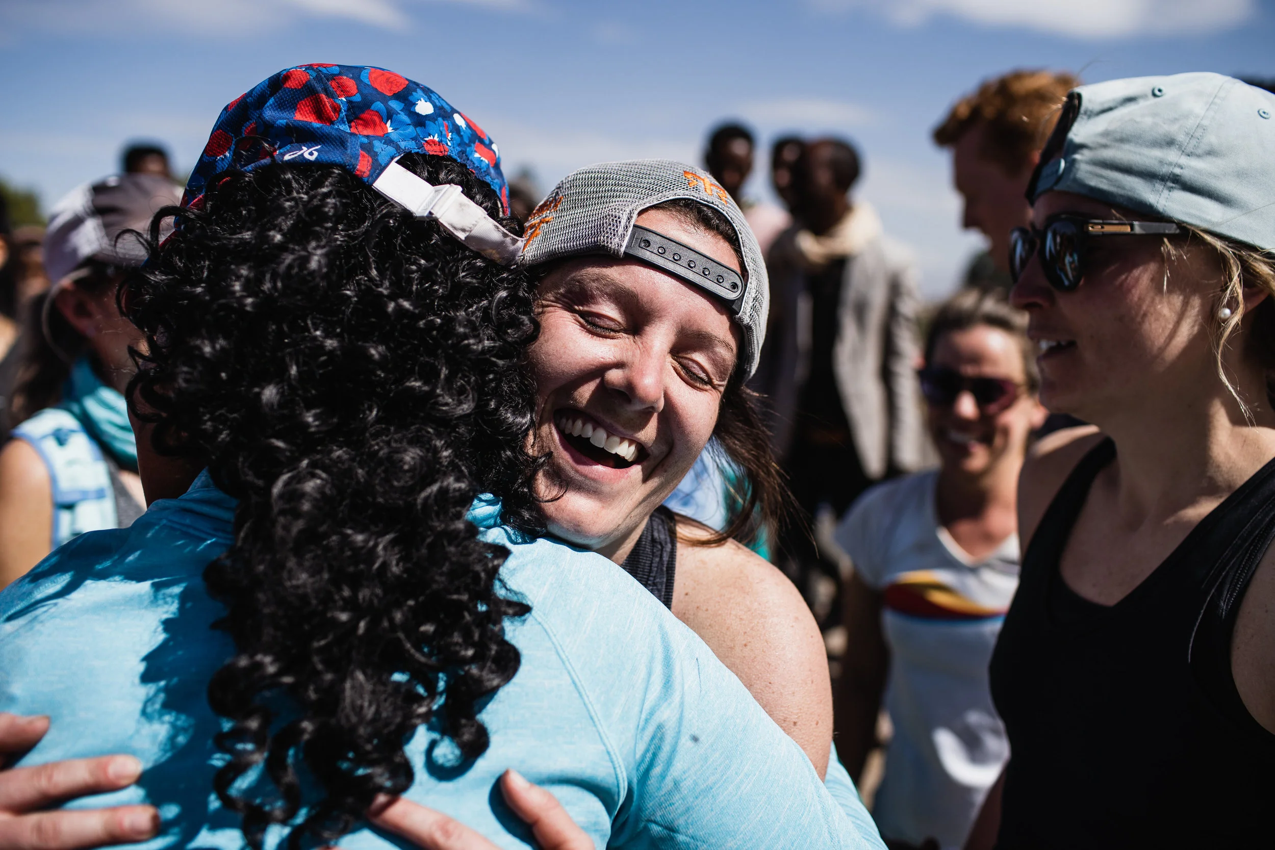 Two runners hugging after a race