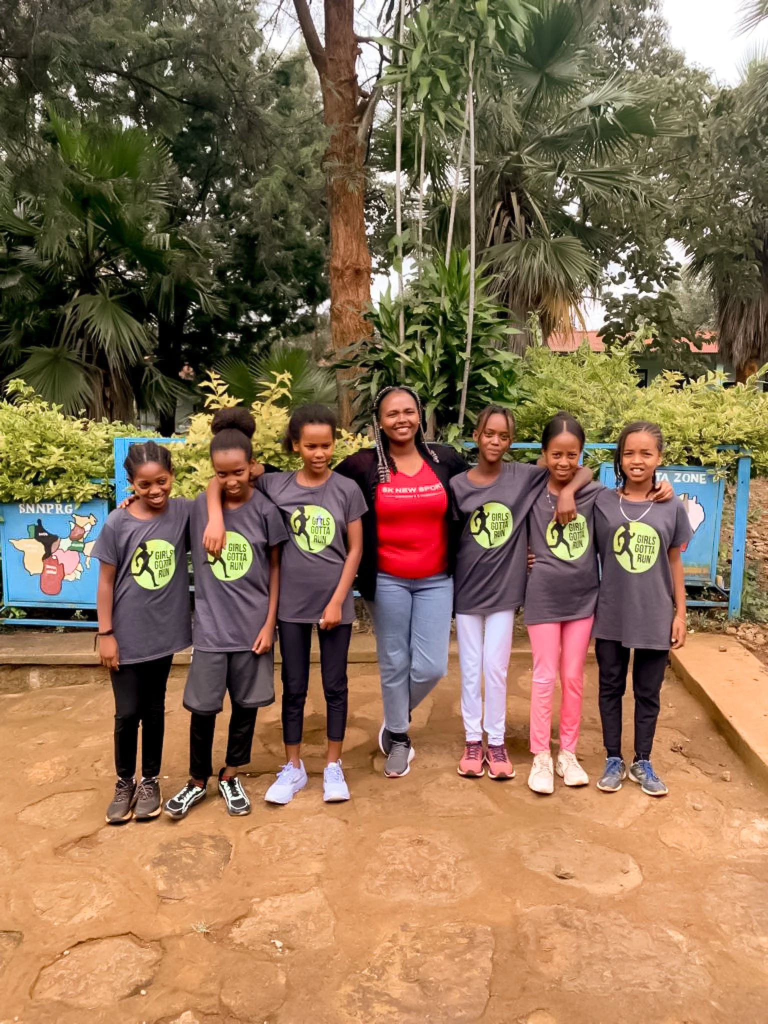 Program manager Kidist standing in the center with 3 Athletic Scholar girls on either side