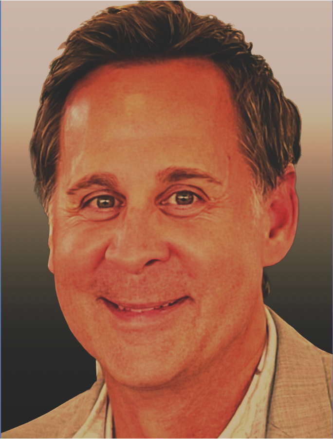 A smiling middle-aged man with dark hair, wearing a light-colored blazer over a shirt, against a gradient background.