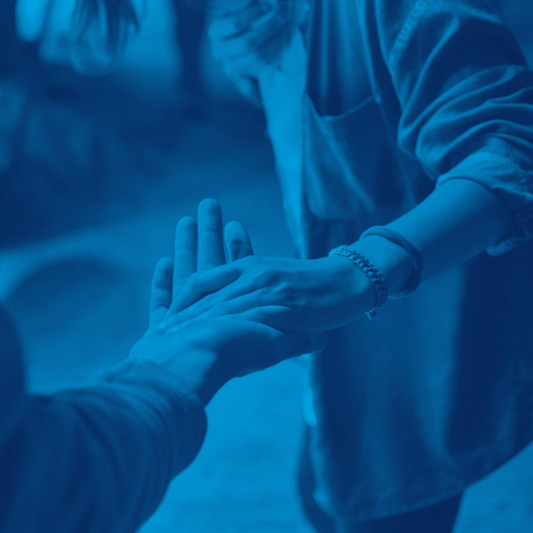 A Person's hand hold another person's hand