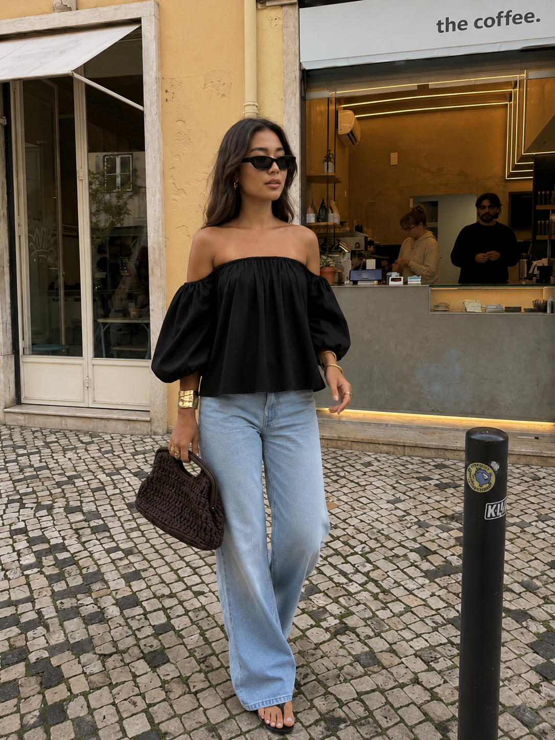 Chic stroll outside a cozy cafe.png