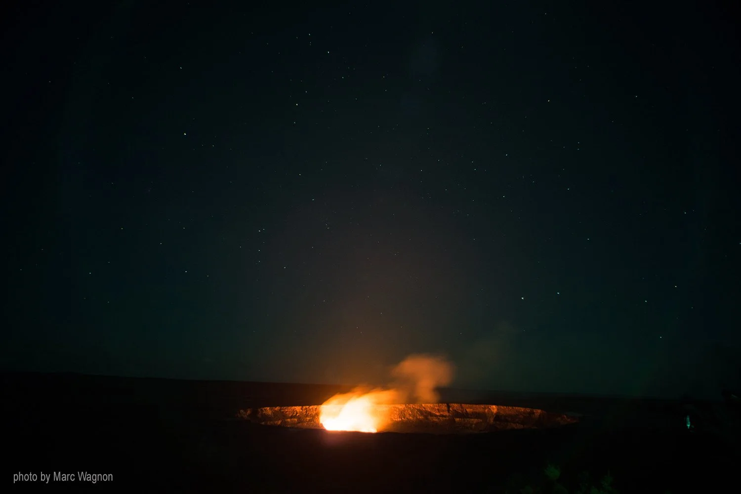 Eruption of mont Kilauea with summer constellations in the background