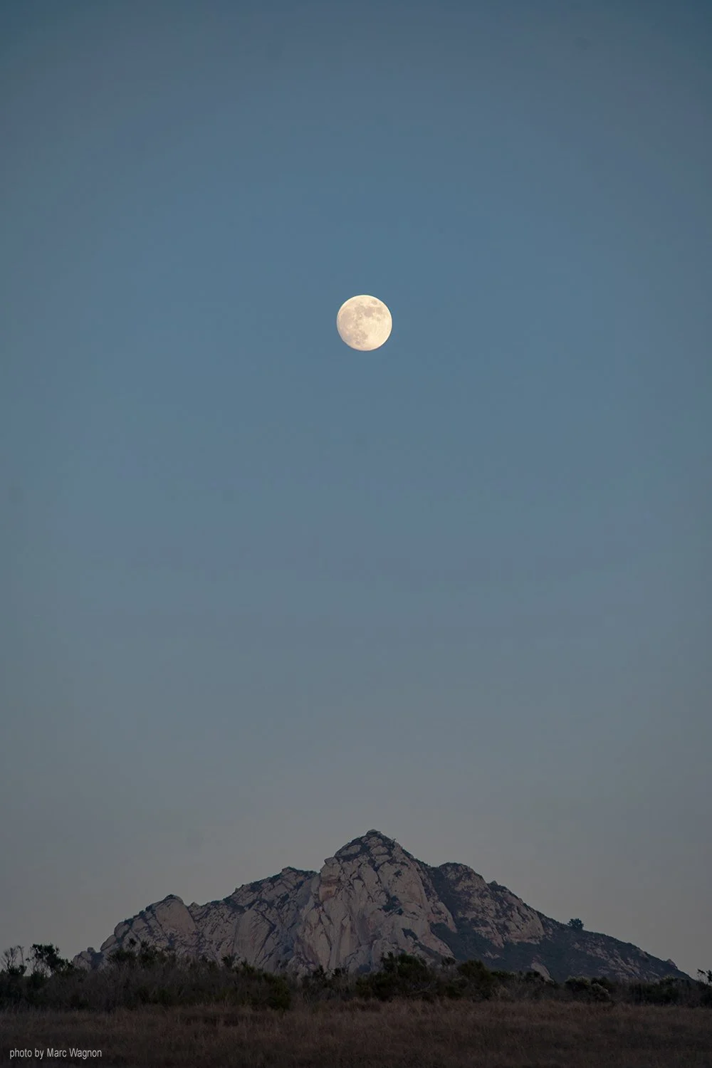 Moon rising over mountain