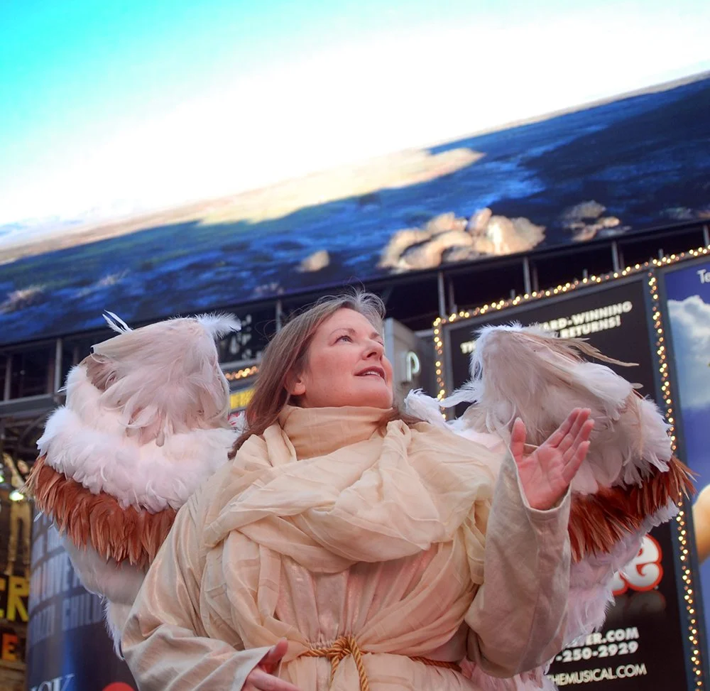 Sarah Pillow dressed as an angel in Time Square