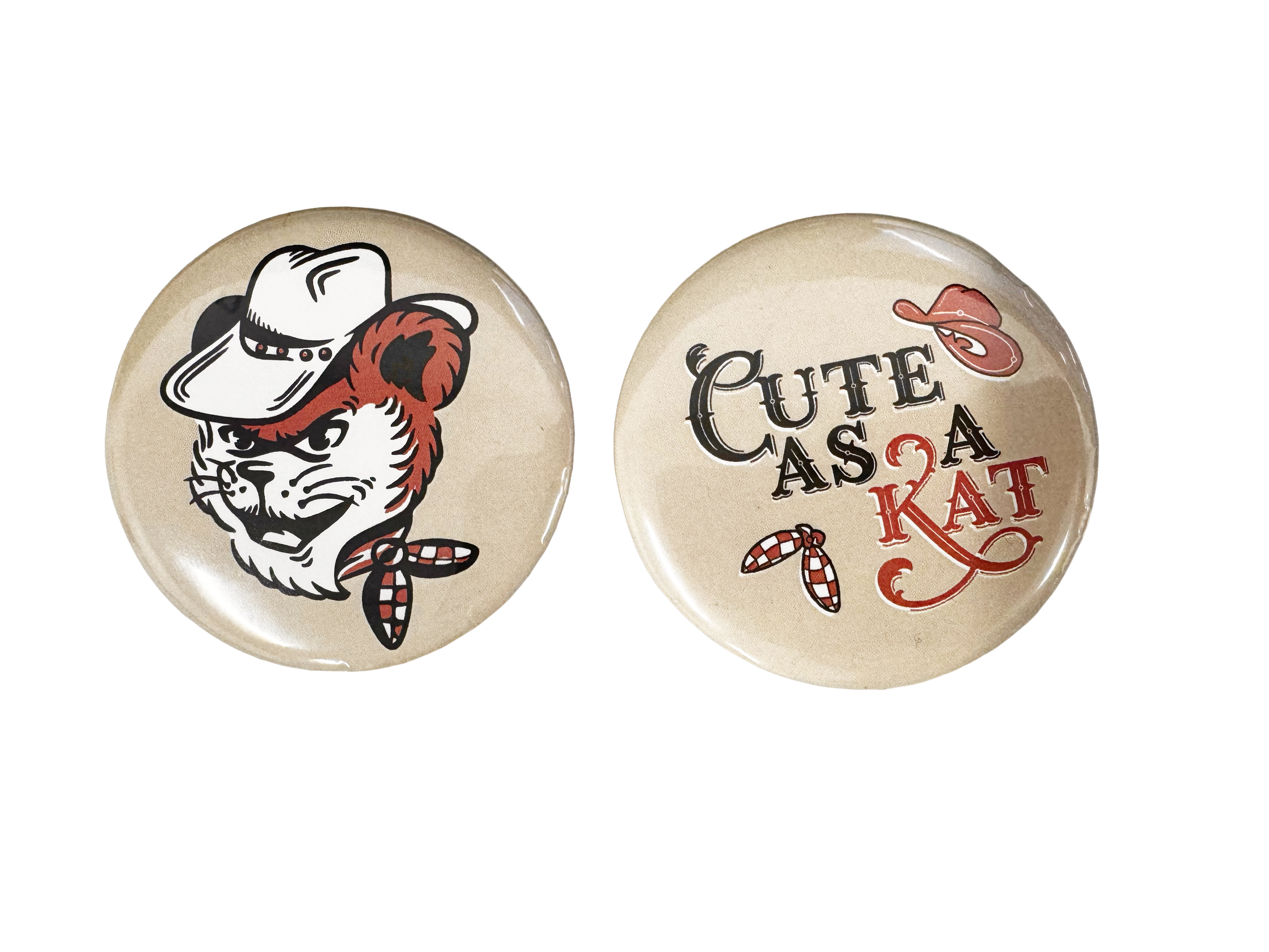 Two decorative kitchen magnets, one featuring a cartoon cat mascot with a cowboy hat and bandana, the other with playful text reading 'Cute as a Kat' with cowboy-themed graphics.