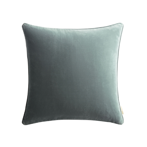 A square, light gray velvet throw pillow on a black background.