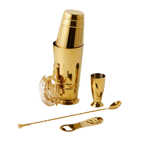 A gold cocktail shaker set with a shaker, shot glass, strainer, spoon, and drinking straw on a black background.