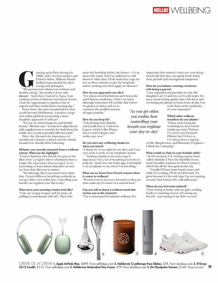 A wellness article layout with a header titled 'HELLO! WELLBEING' and a collection of skincare and wellness products including headphones, a facial device, a glass pipette, a scented candle, a tube of skincare cream, and athletic shoes. The layout features questions and answers about health, skincare, and wellness practices.