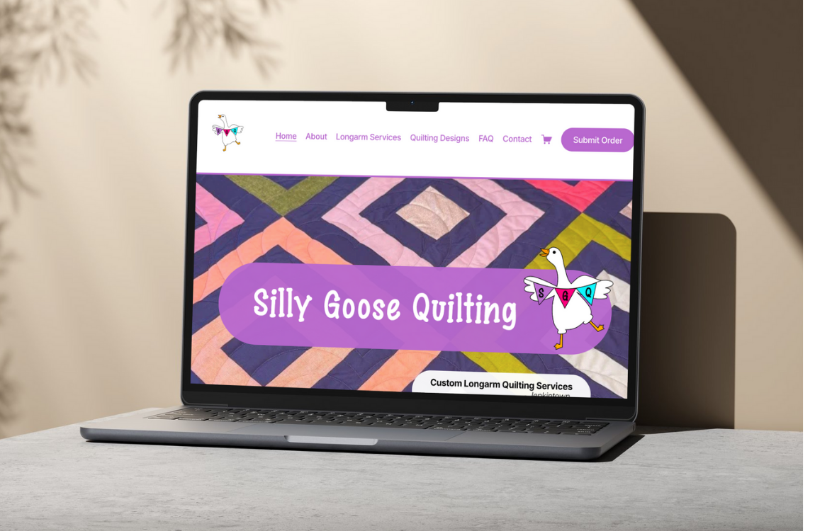 A website on a laptop screen displaying Silly Goose Quilting, with a colorful quilt background and a cartoon goose logo.