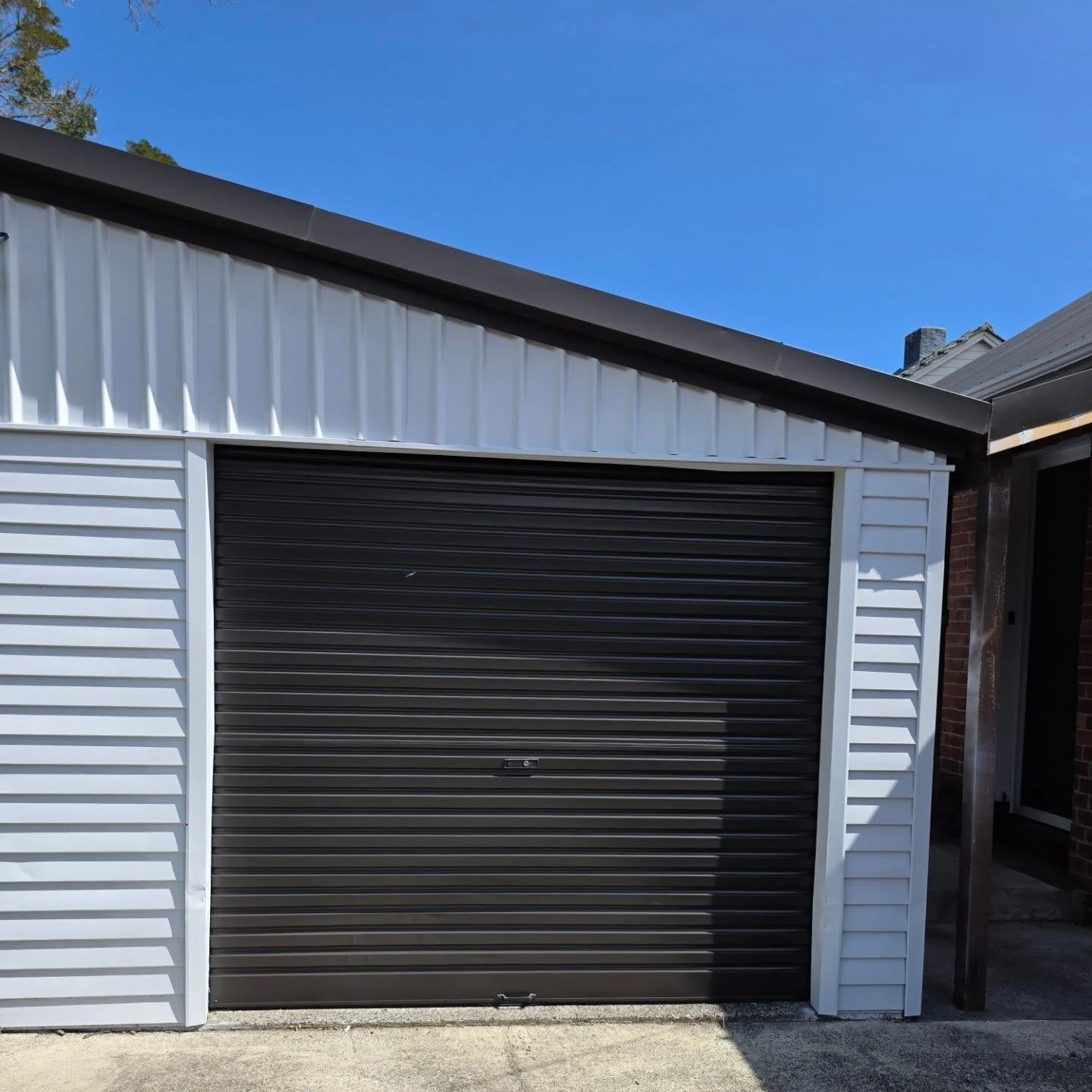 This old brown garage door had definitely seen better days. After proper prep and a fresh modern colour, it now matches the roof perfectly  giving the home a clean, cohesive look.

These are the small upgrades that make a big impact on street appeal.