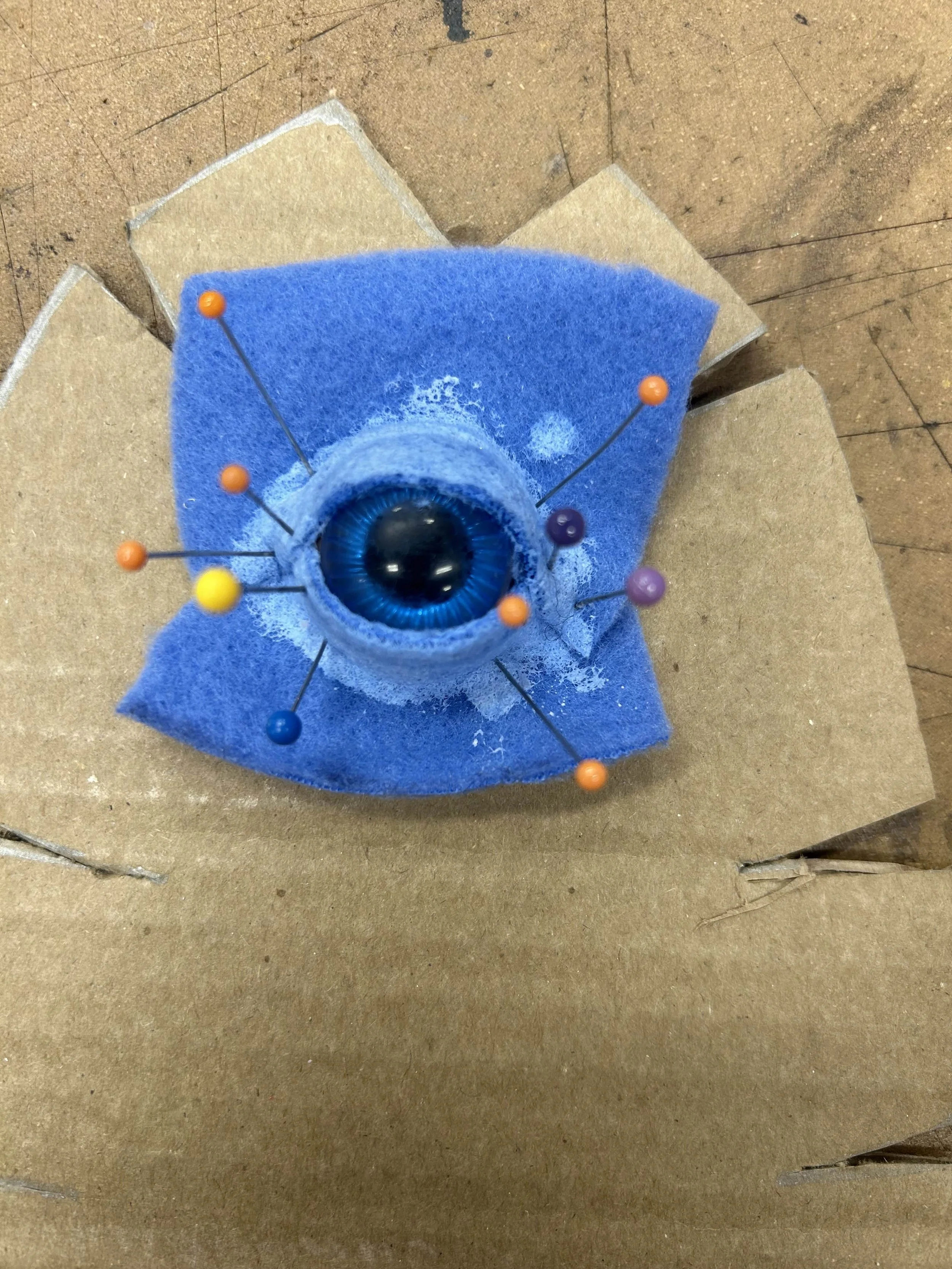 Creation of the eyes using the same felt + Mod Podge technique used in the wooden head.