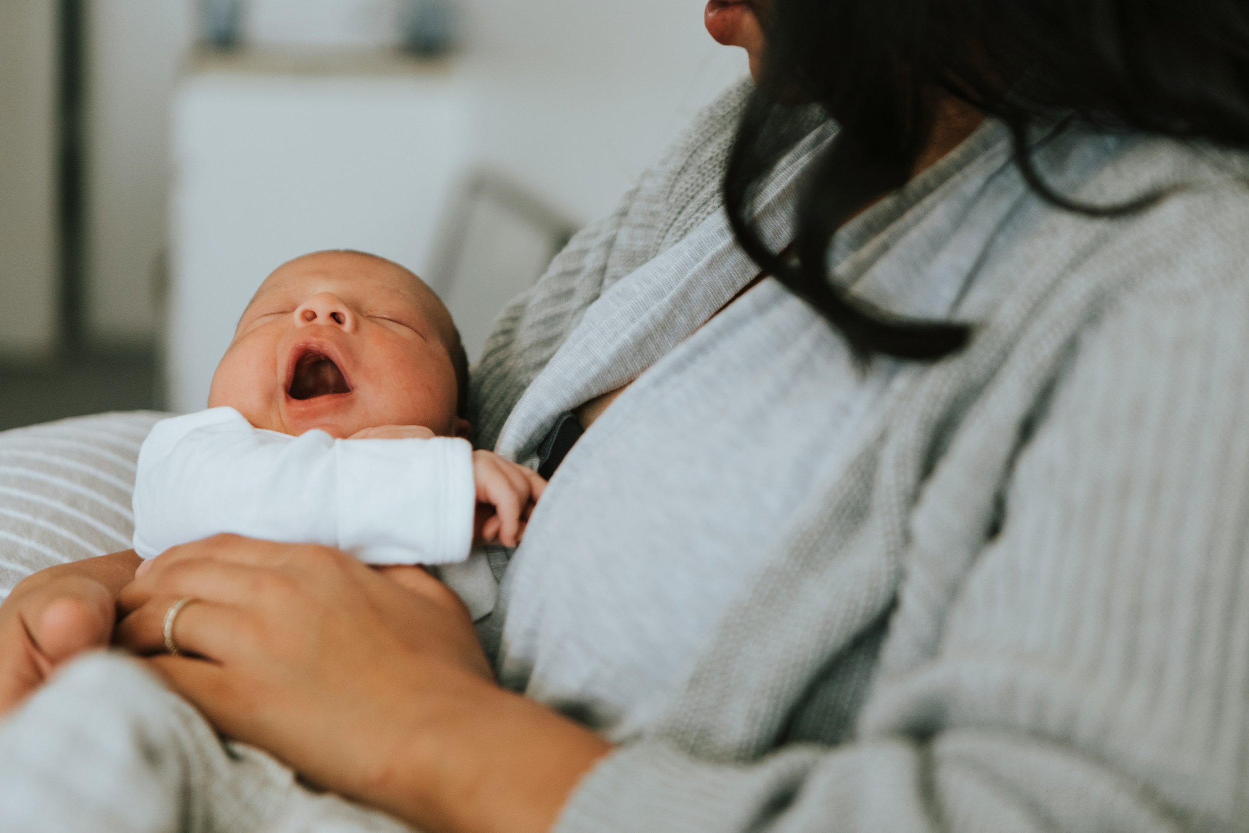 Yawning newborn baby — infant chiropractic care for feeding and colic at Rhythm Health Santa Cruz