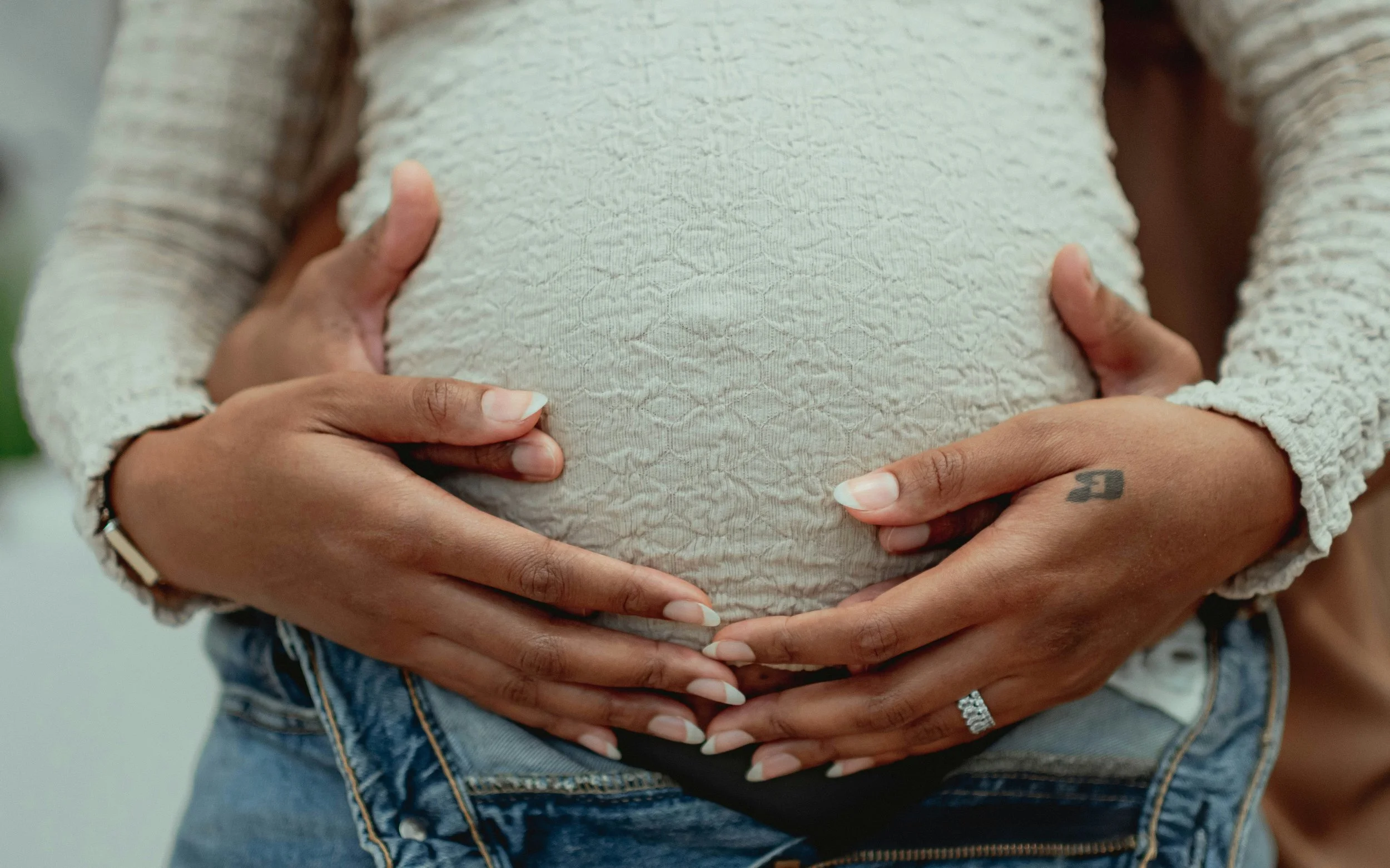 Close-up of pregnant belly — perinatal chiropractic care for conception and pregnancy in Santa Cruz