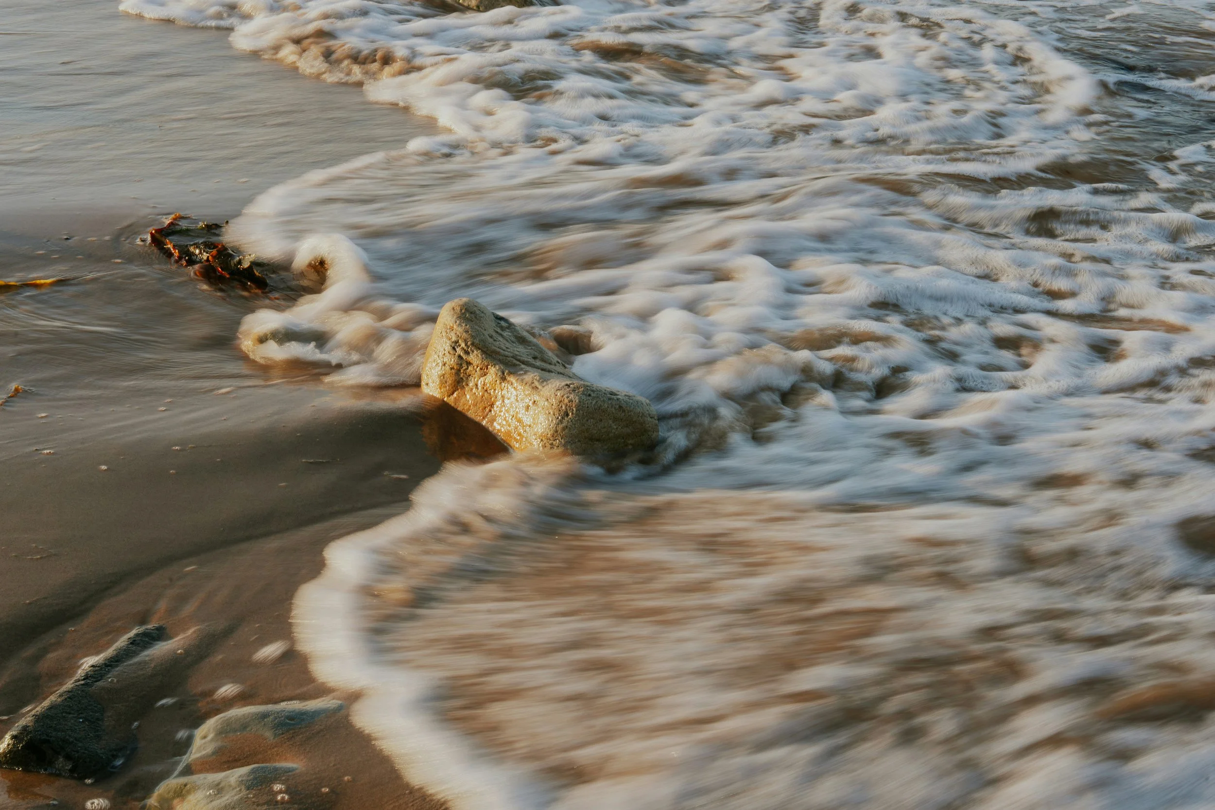 Ocean waves on a Santa Cruz beach — Rhythm Health & Performance offers chiropractic intensives for out-of-town patients