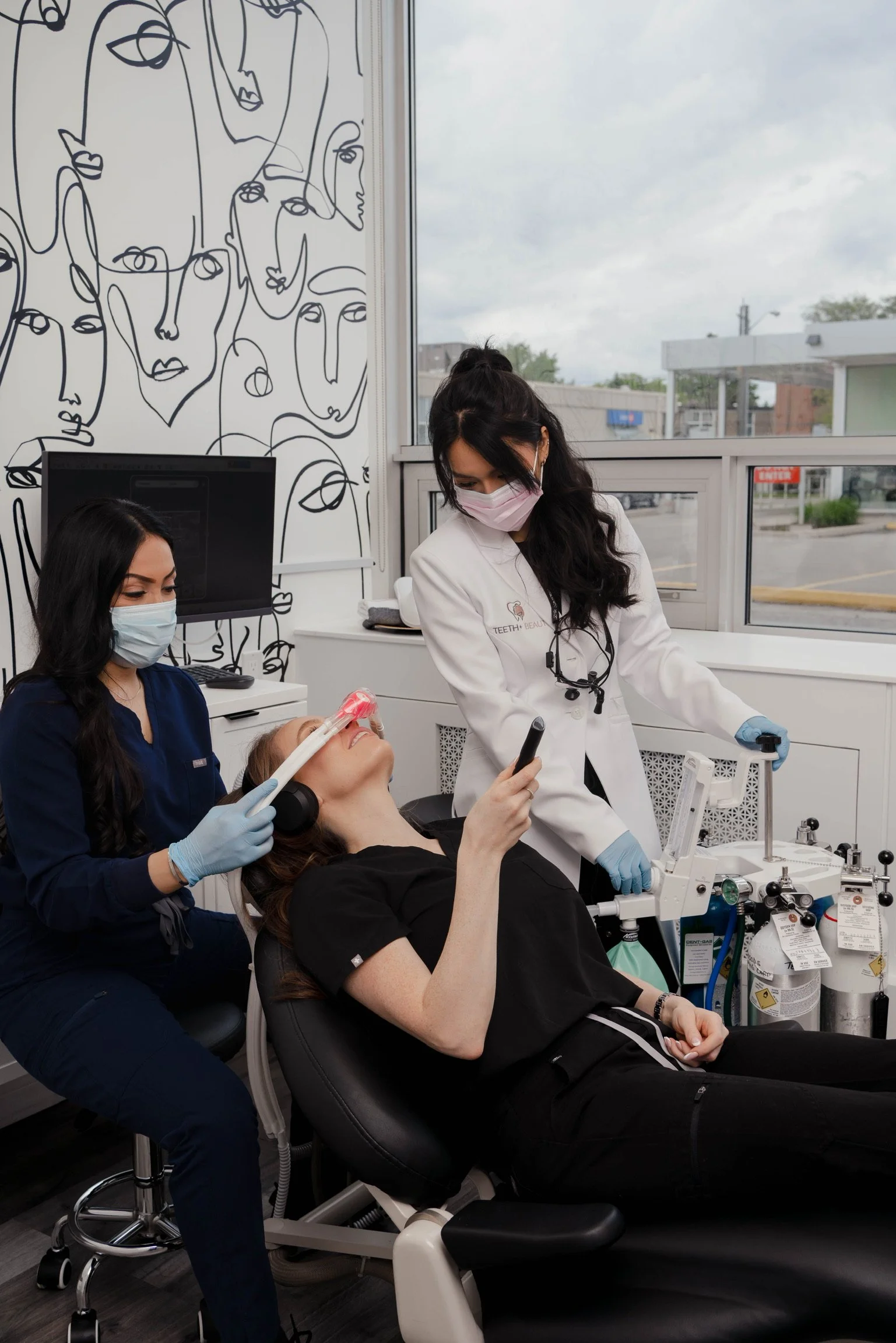 Dental filling procedure performed by dentist and assistant at Teeth & Beauty dental clinic in Toronto.