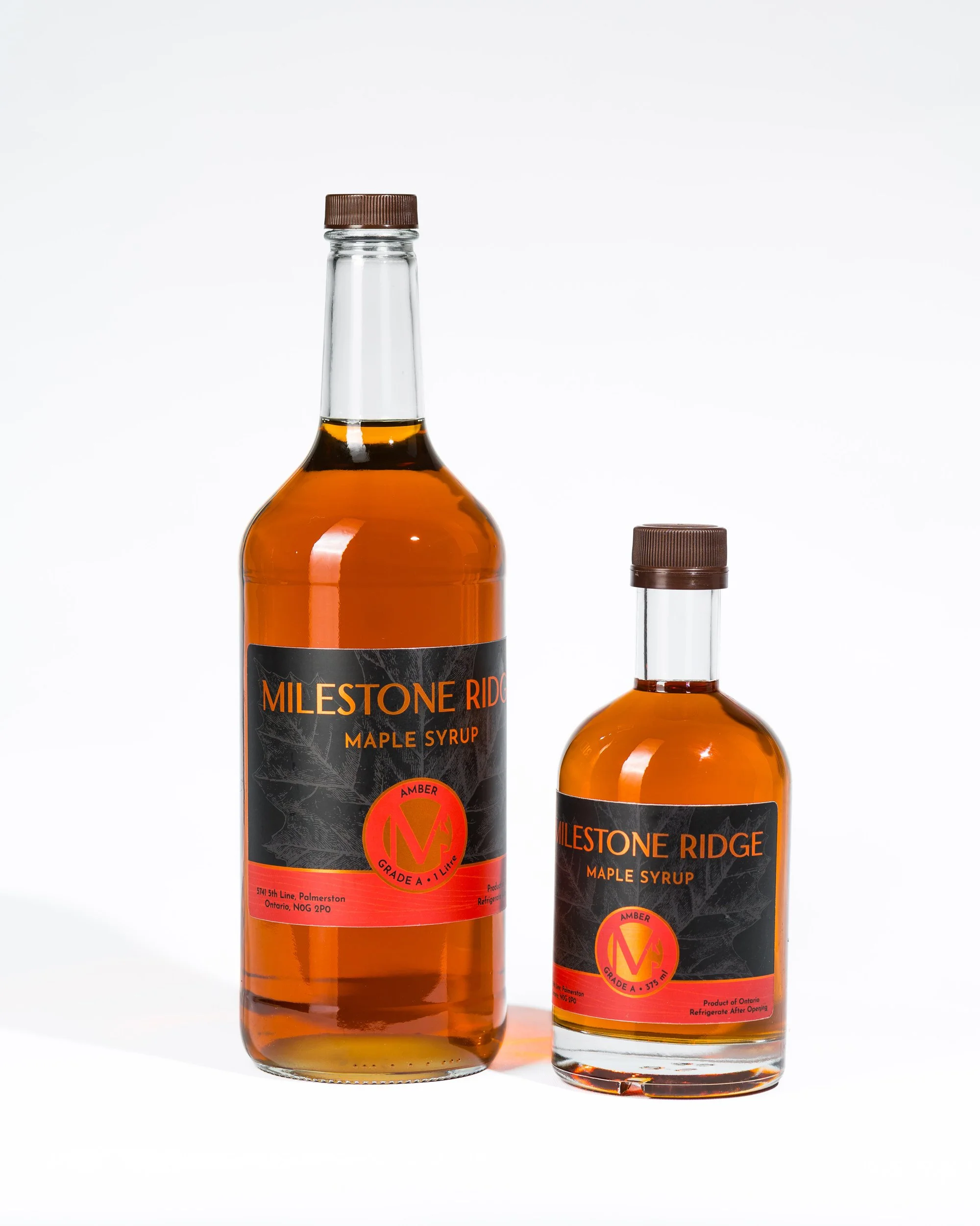 2 bottles of Milestone Ridge Maple Syrup - Pure Ontario maple syrup from Palmerston, Ontario, Canada. Grade A maple syrup available for purchase in golden maple syrup, amber maple syrup, dark maple syrup, bourbon barrel-aged maple syrup.