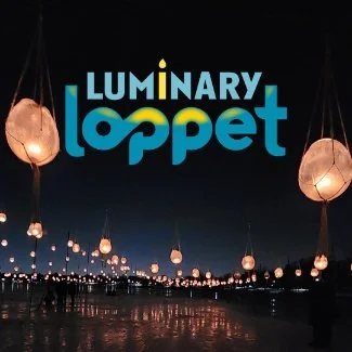 Volunteer with Dark Clouds Silver Lining: Luminary Loppet