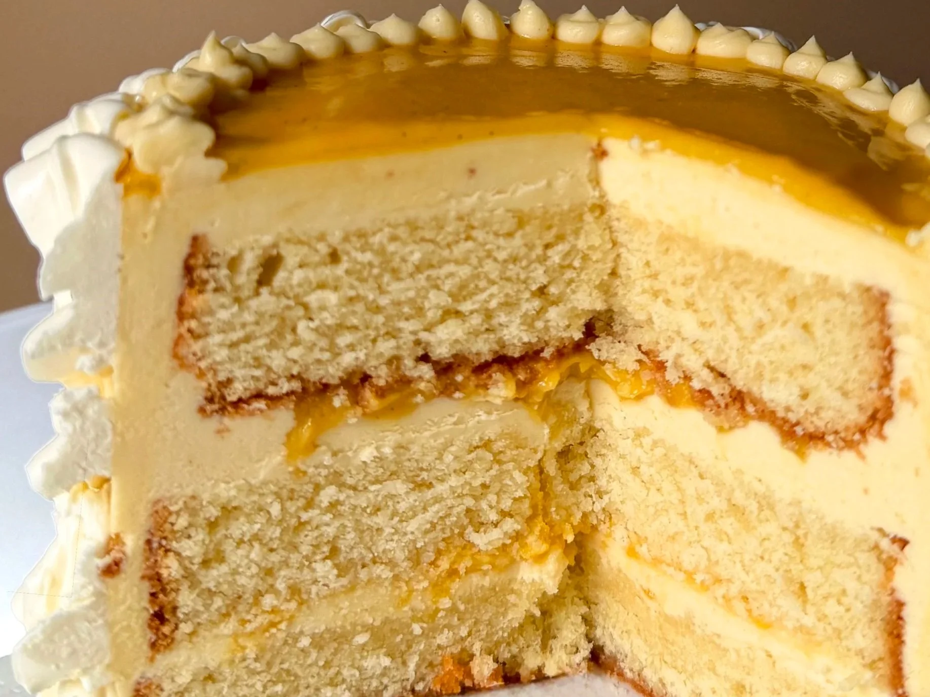 Torta Carioca:
white chocolate sponge, fresh passionfruit curd, passionfruit swiss meringue buttercream, white chocolate ganache