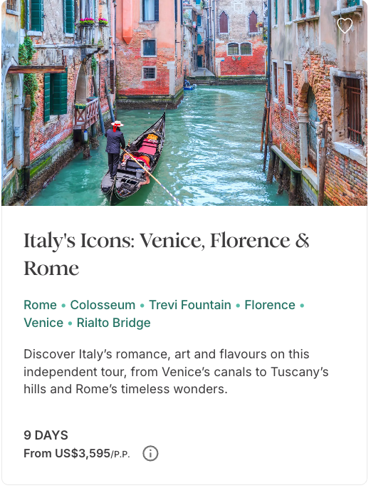Gondola traveling through a Venice canal surrounded by colorful historic buildings in Italy.