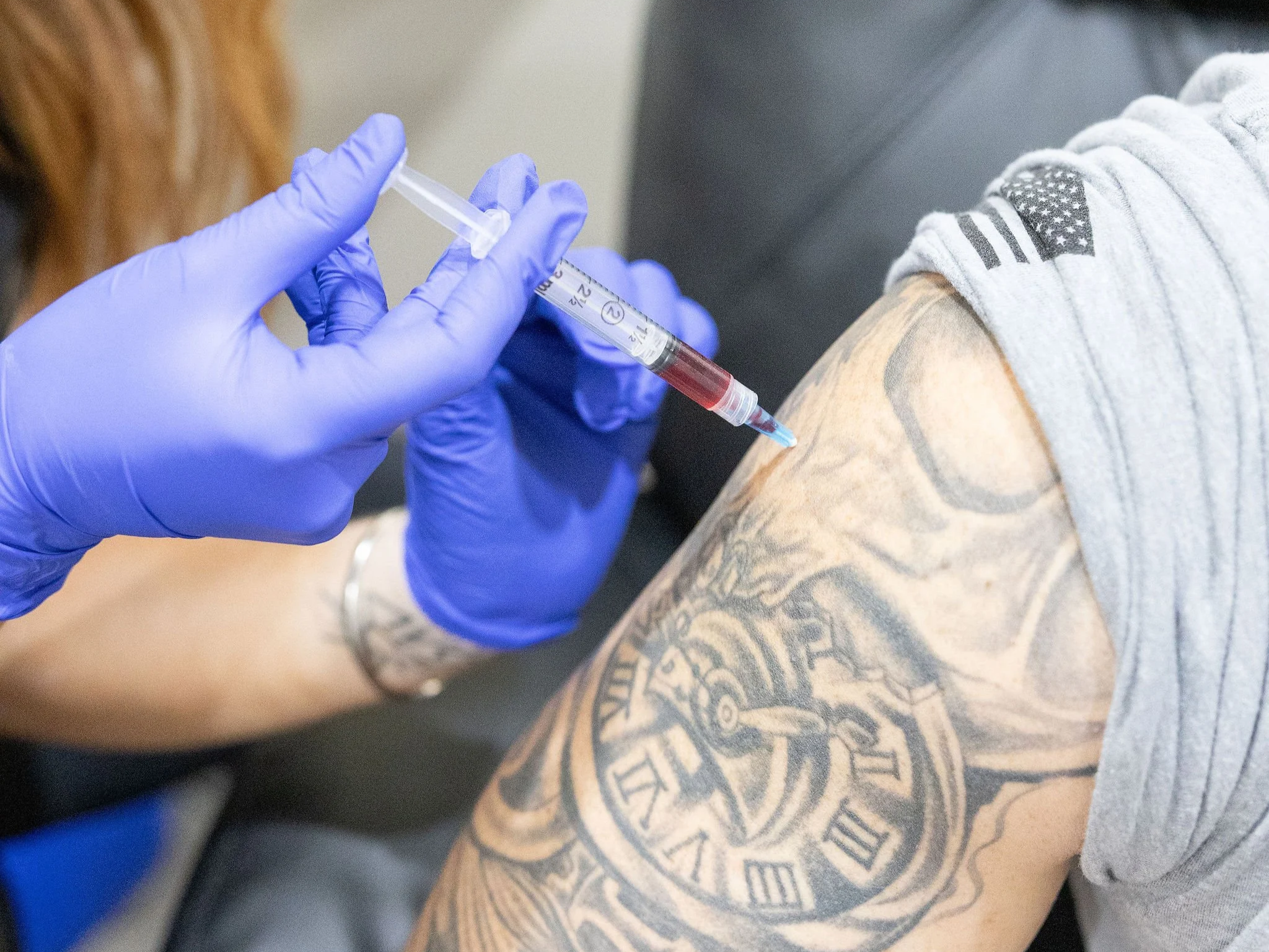 Wellness professional administering a Vitamin B12 shot for natural energy boost in Florence, South Carolina.