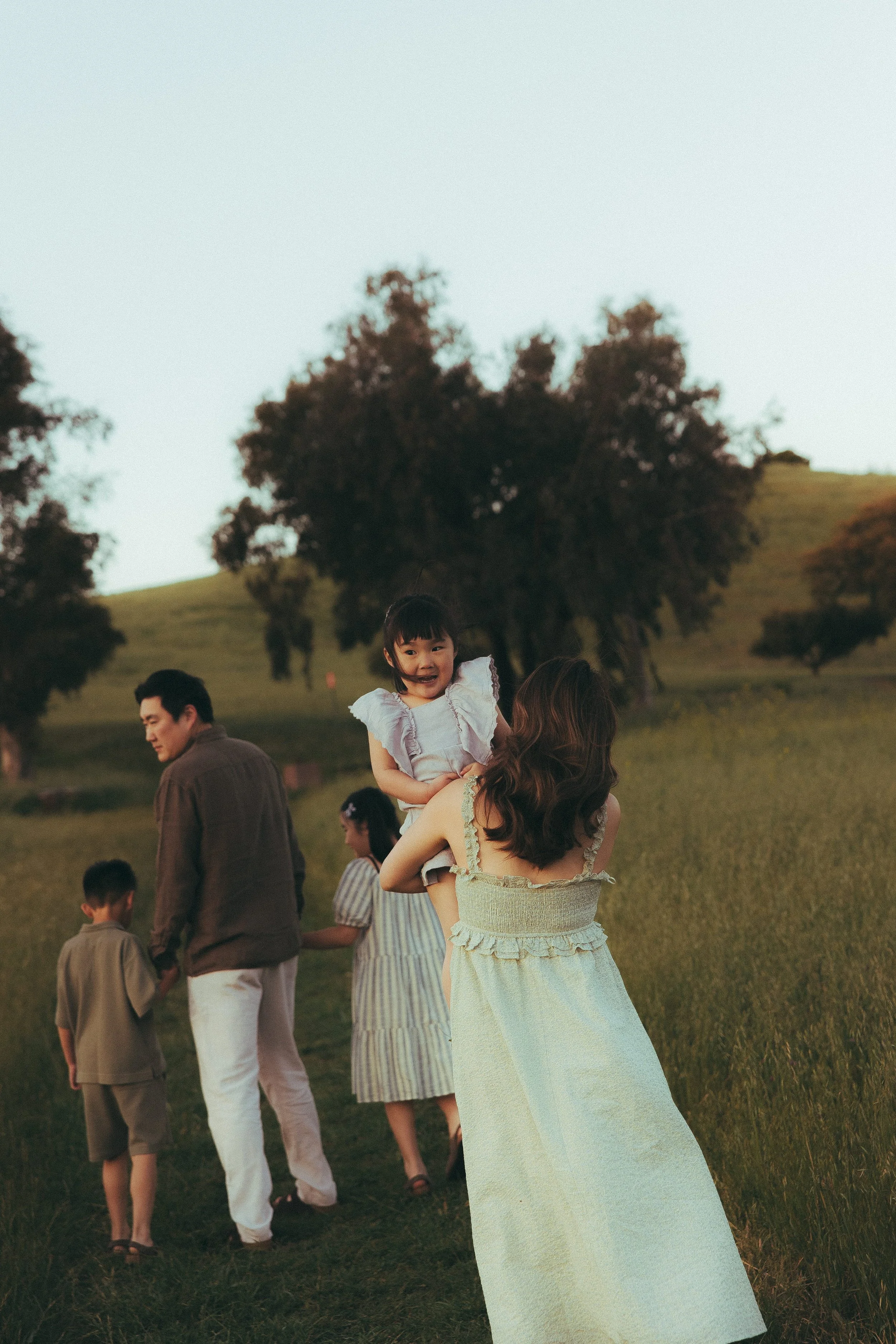 Oahu family photographer capturing mother and daughter at sunset