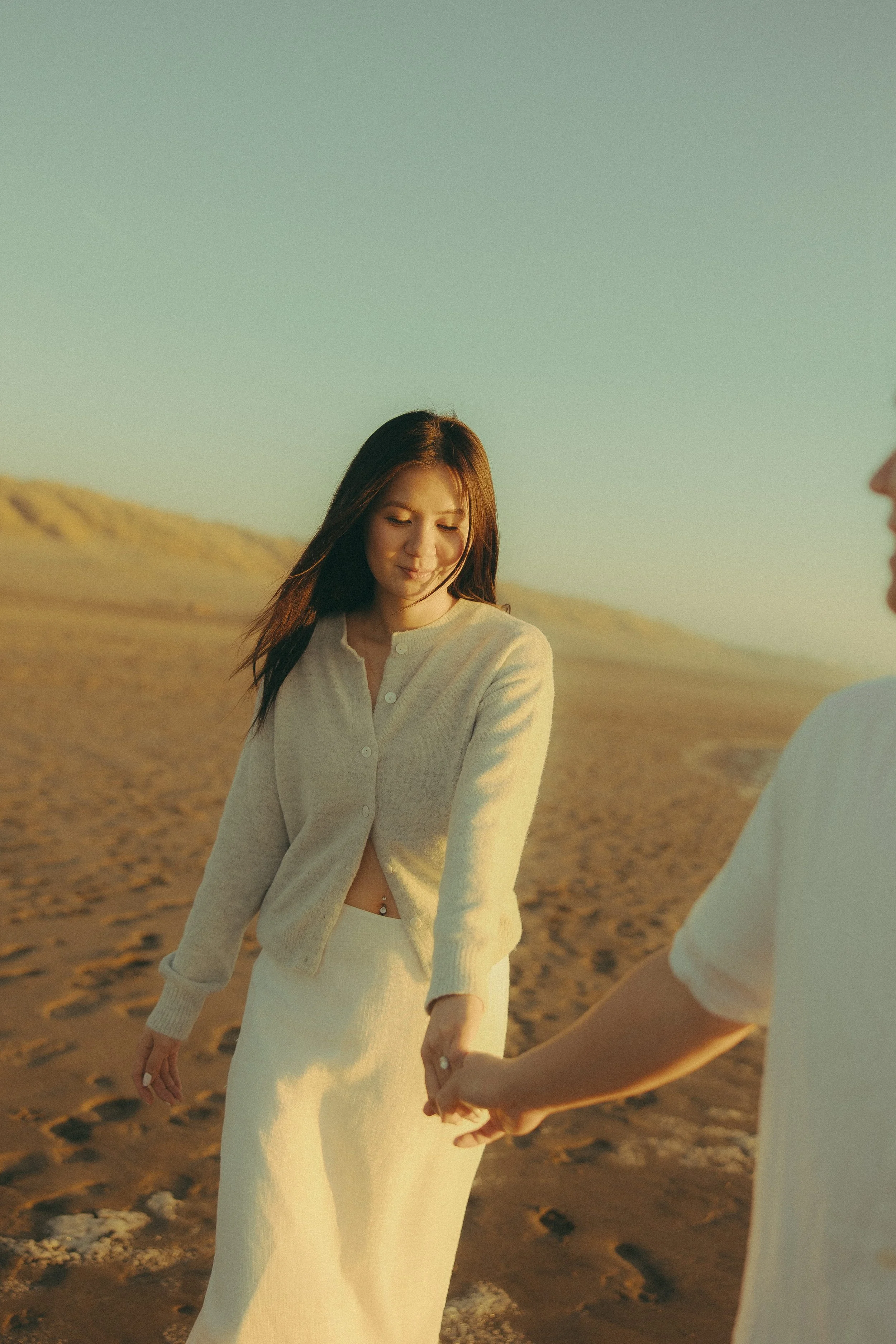 Oahu beach couples session holding hands at sunset