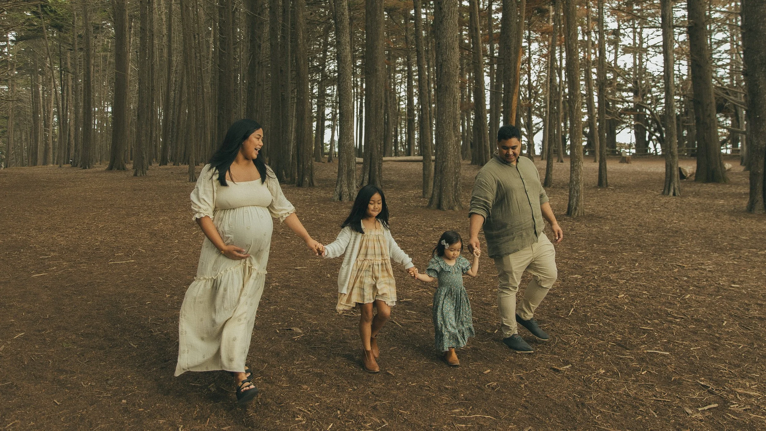 Oahu family photography walking in wooded park