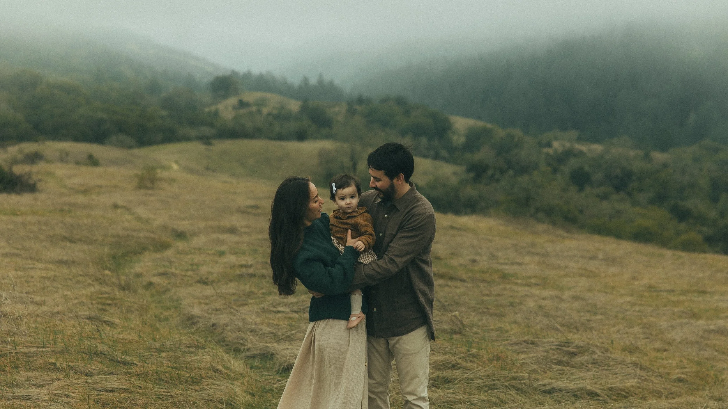 Oahu family of three outdoor portrait with mountains
